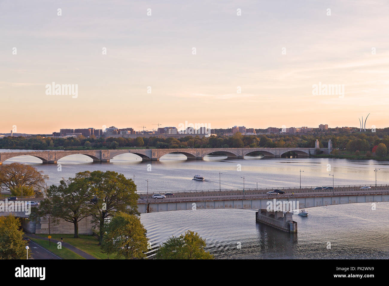 Washington DC panorama with bridges across Potomac River at sunset. Scenic view on US capital landscape in early fall. Stock Photo