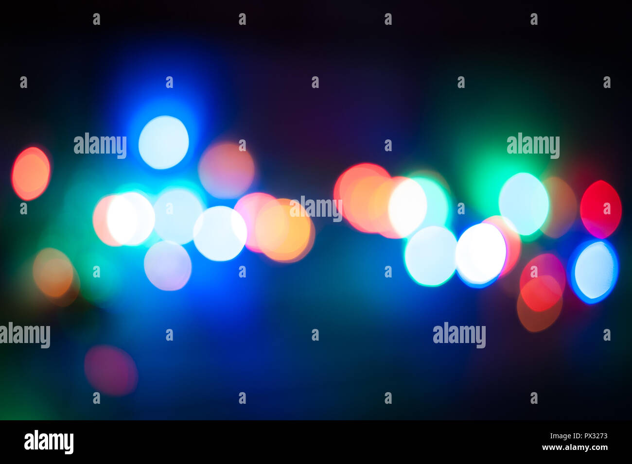Multicolor defocused bokeh lights in the night background Stock Photo