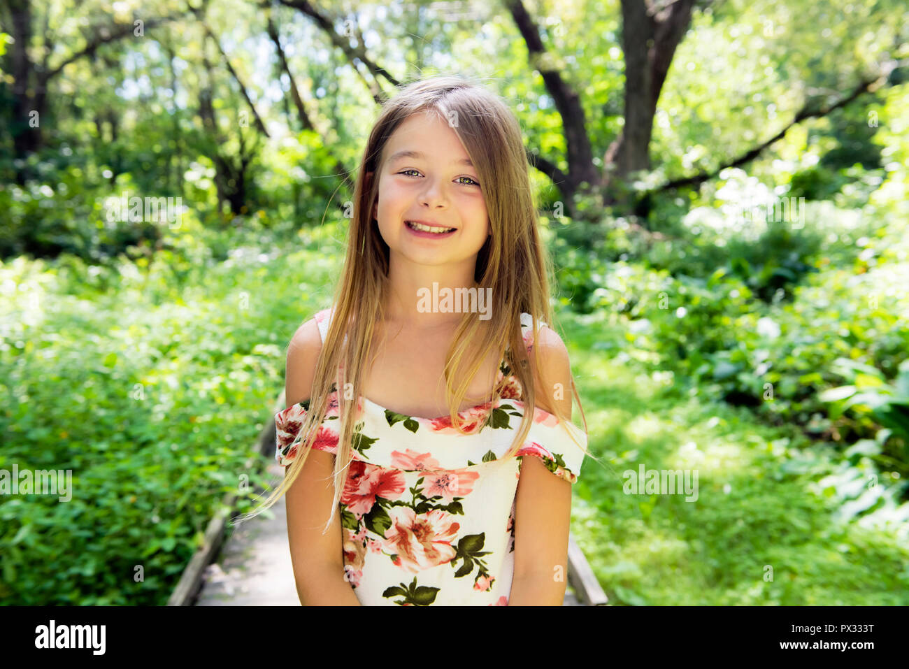 A cute girl portrait in the forest Stock Photo - Alamy