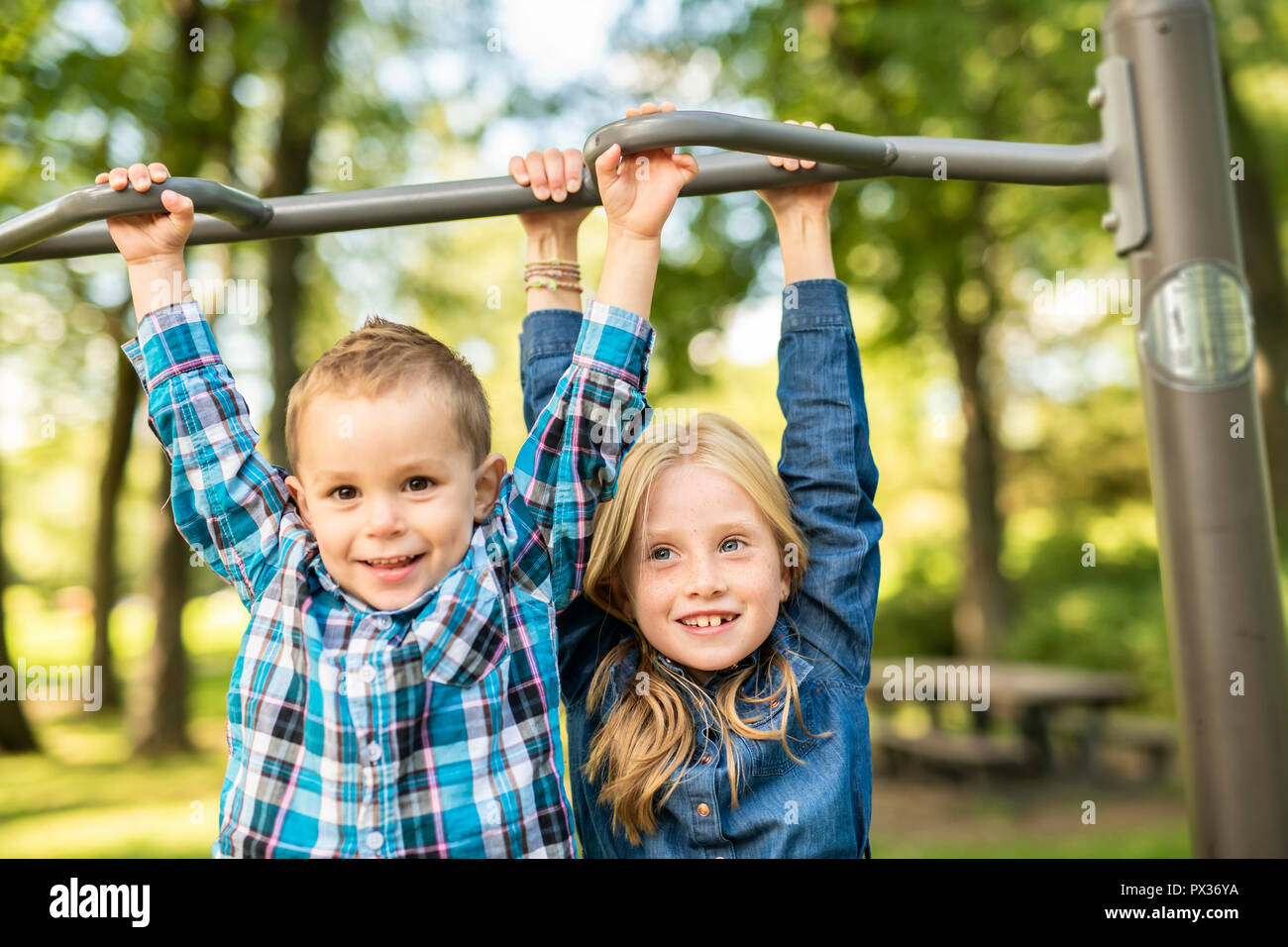 The Two young children having fun on the playground Stock Photo