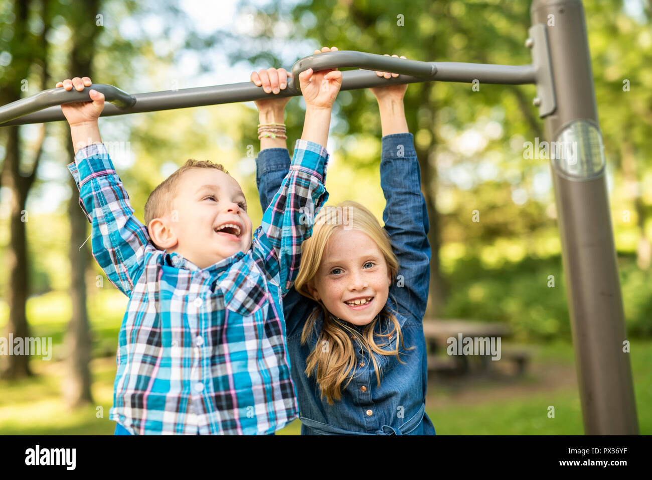 The Two young children having fun on the playground Stock Photo