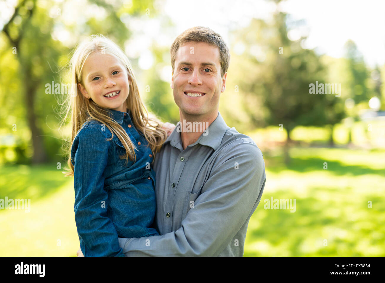 A father with daughter in summer park Stock Photo - Alamy