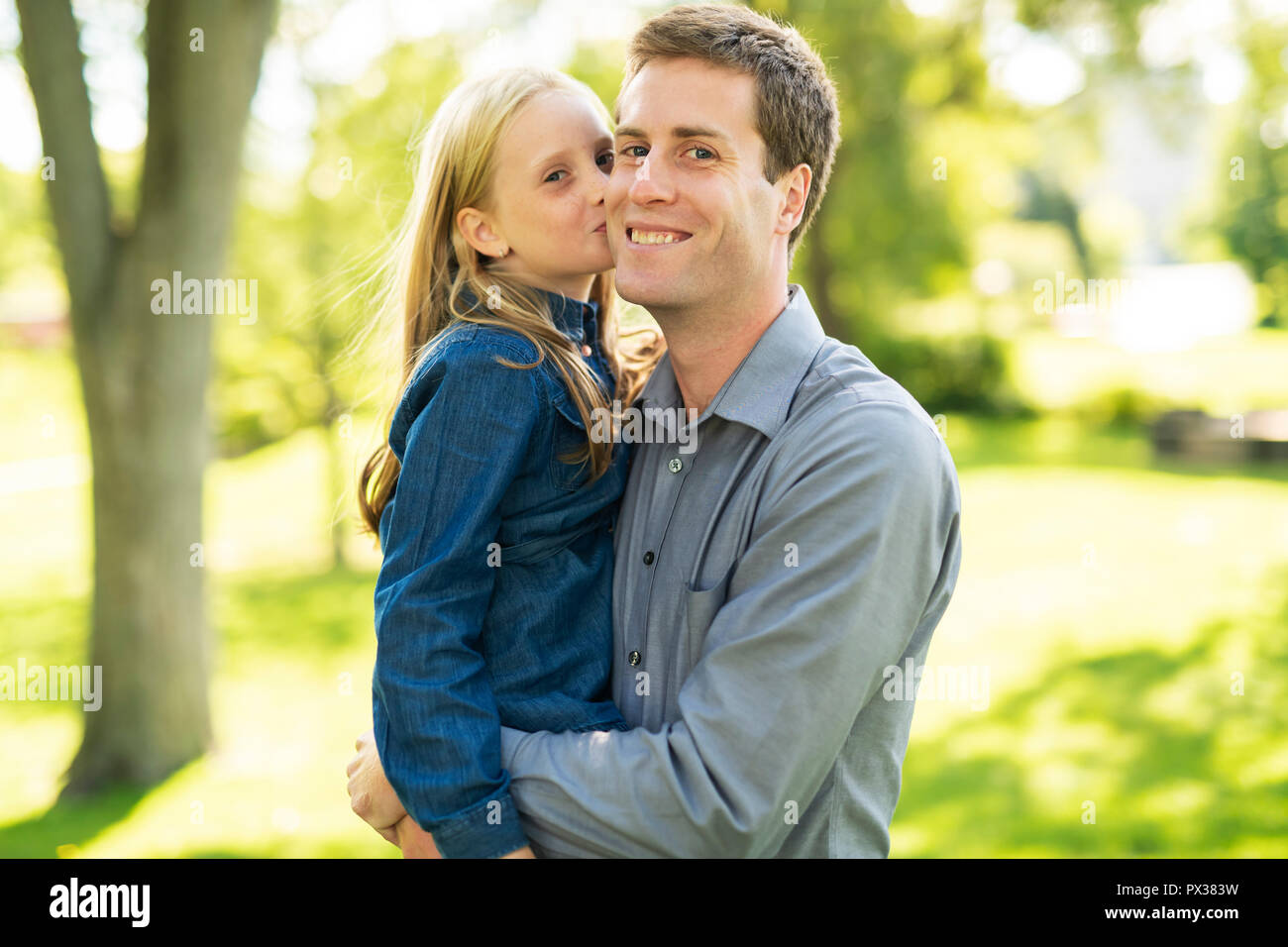 A father with daughter in summer park Stock Photo - Alamy