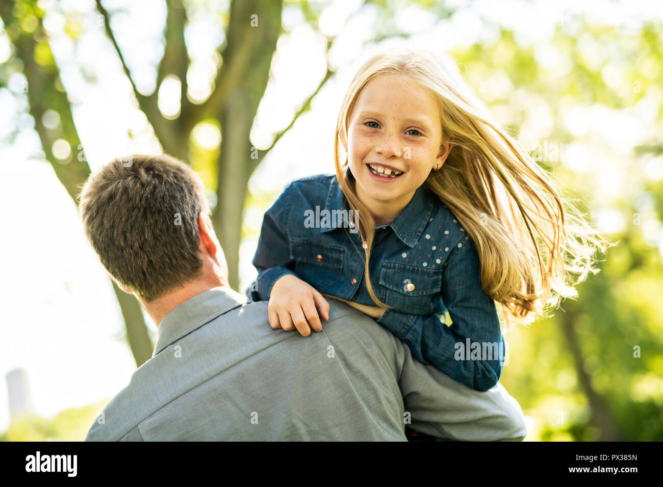 A father with daughter in summer park Stock Photo - Alamy
