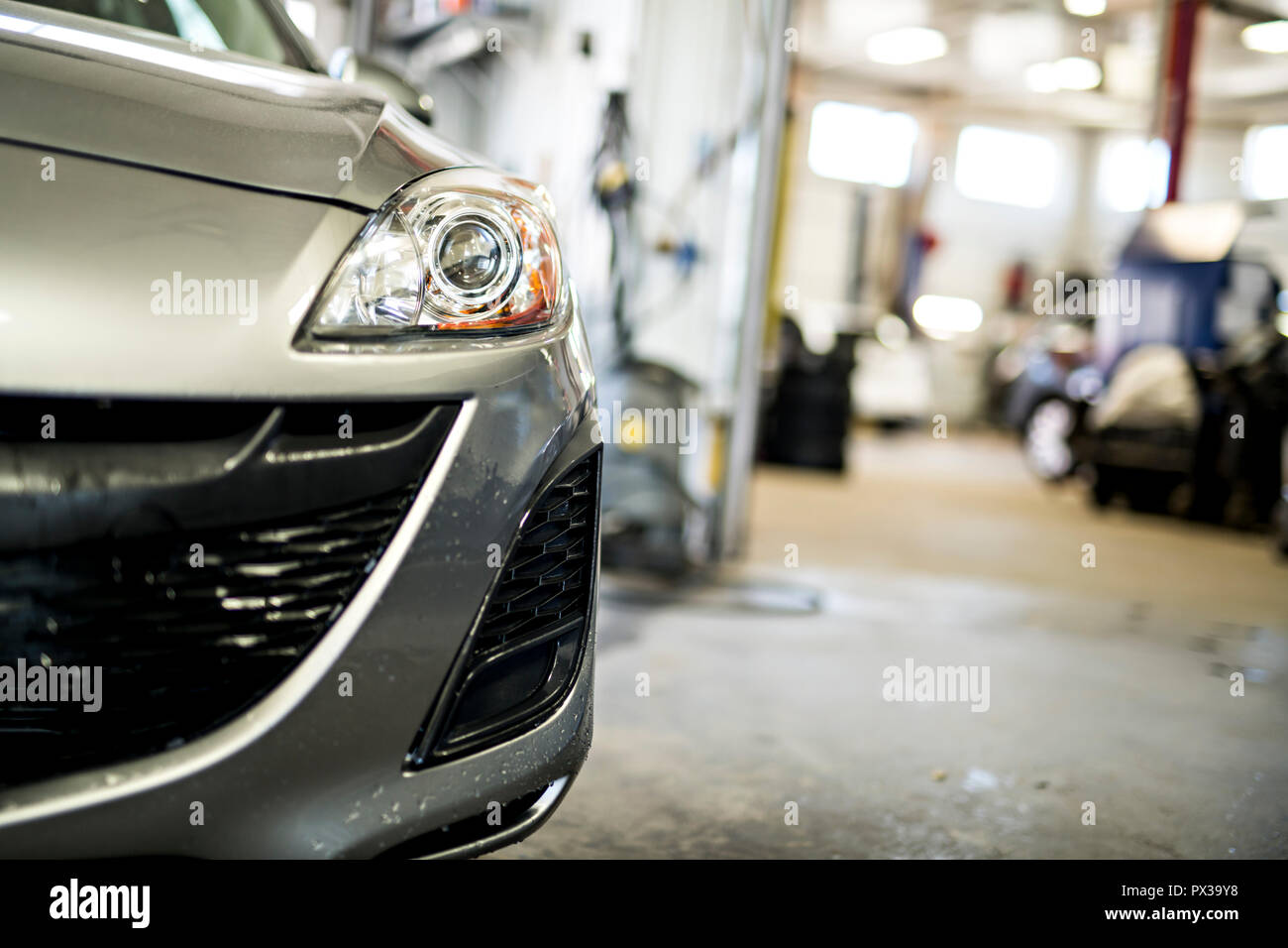 Front view of parked car in garage Stock Photo