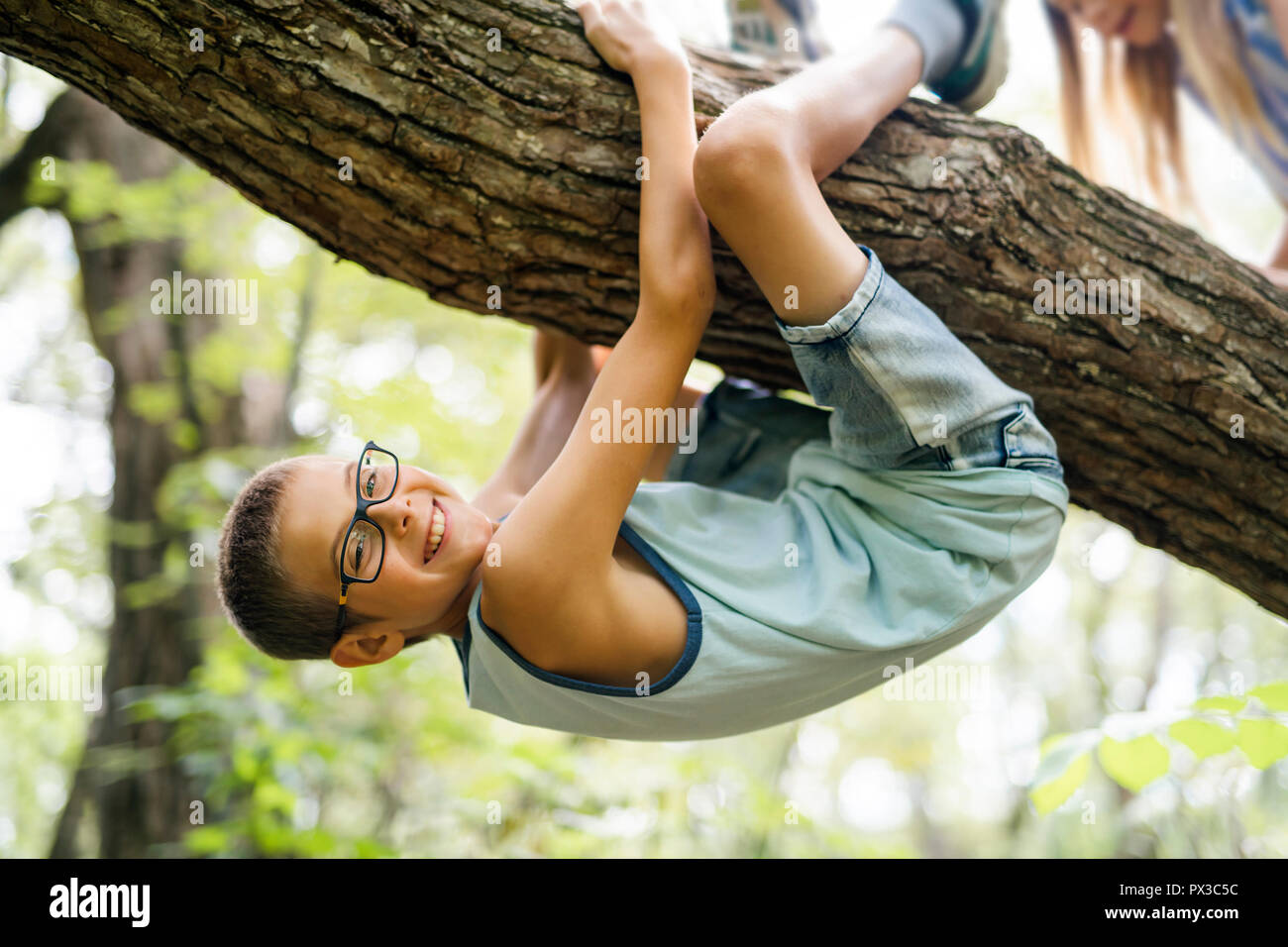 Portrait of a happy young boy outdoors forest Stock Photo - Alamy