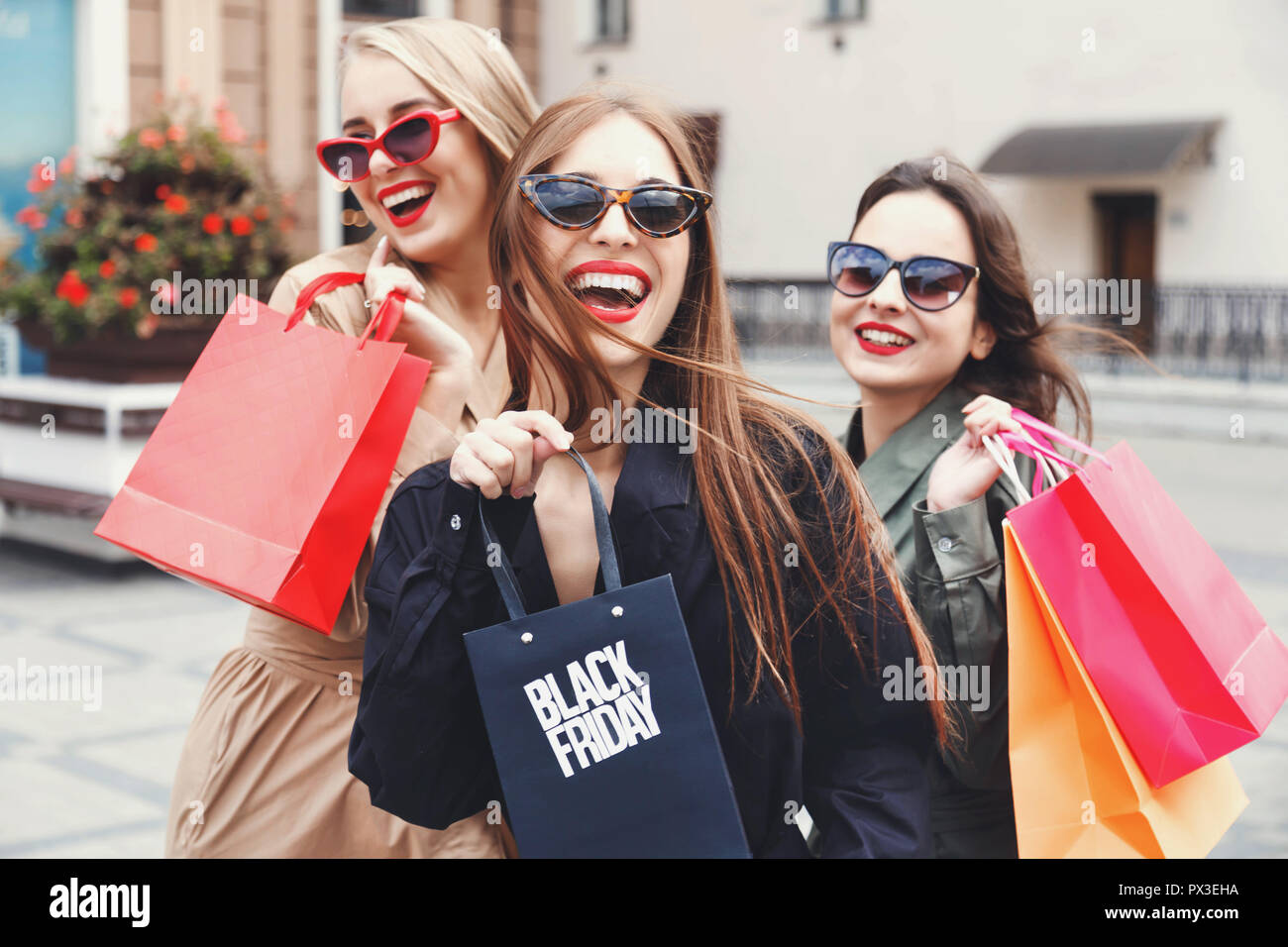 Ladies with shop shopping bags