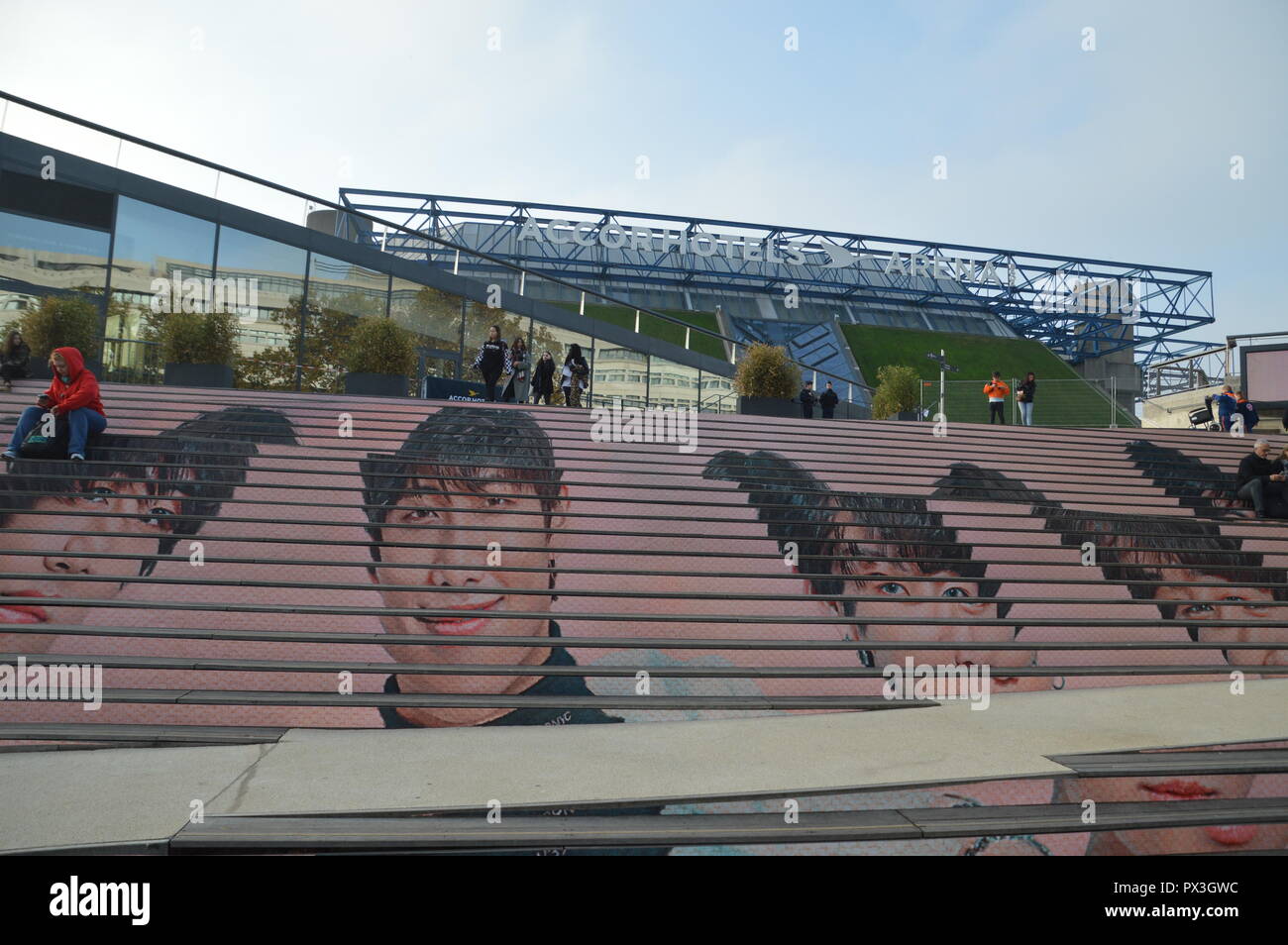 Paris, France. 19th October, 2018. Portraits of the BTS painted on stairs. Fans of kpop band BTS (Bangtan Boys or Bulletproof Boy Scouts)are sleeping outdoor waiting since the eve for the concert at Paris-Bercy (Accord Hotel Arena). 19 october 2018.  ALPHACIT NEWIM / Alamy Live News Stock Photo