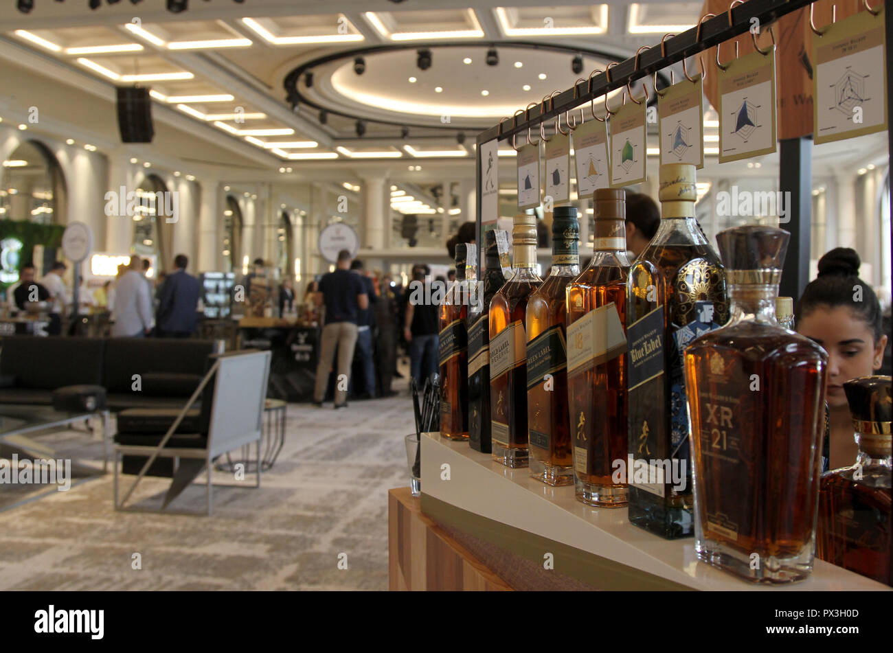 Beirut, Lebanon. 18th Oct, 2018. People visit the 3rd edition of Whisky Live Beirut, in Beirut, Lebanon, on Oct. 18, 2018. The 3rd edition of Whisky Live Beirut opened on Thursday. More than 60 international whisky brands display their products to the public during the three-day event. Credit: Bilal Jawich/Xinhua/Alamy Live News Stock Photo