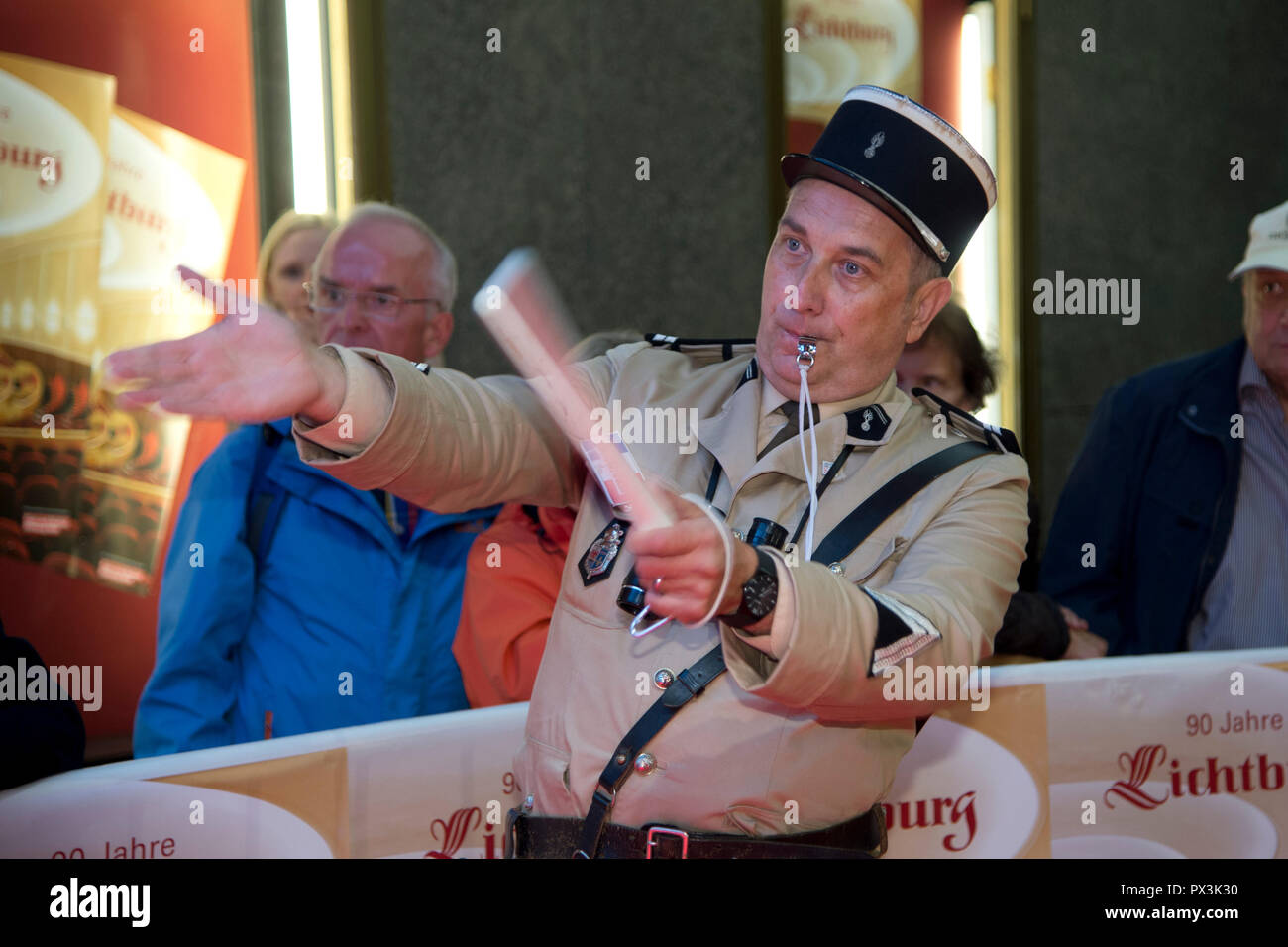 A film fan in the uniform of the French film policeman Francois Cruchot greets the guests on the red carpet, red carpet, Red Carpet Show, arrival, arrival, ceremony on occasion of the 90th anniversary of the Lichtburg cinema in Essen, | usage worldwide Stock Photo