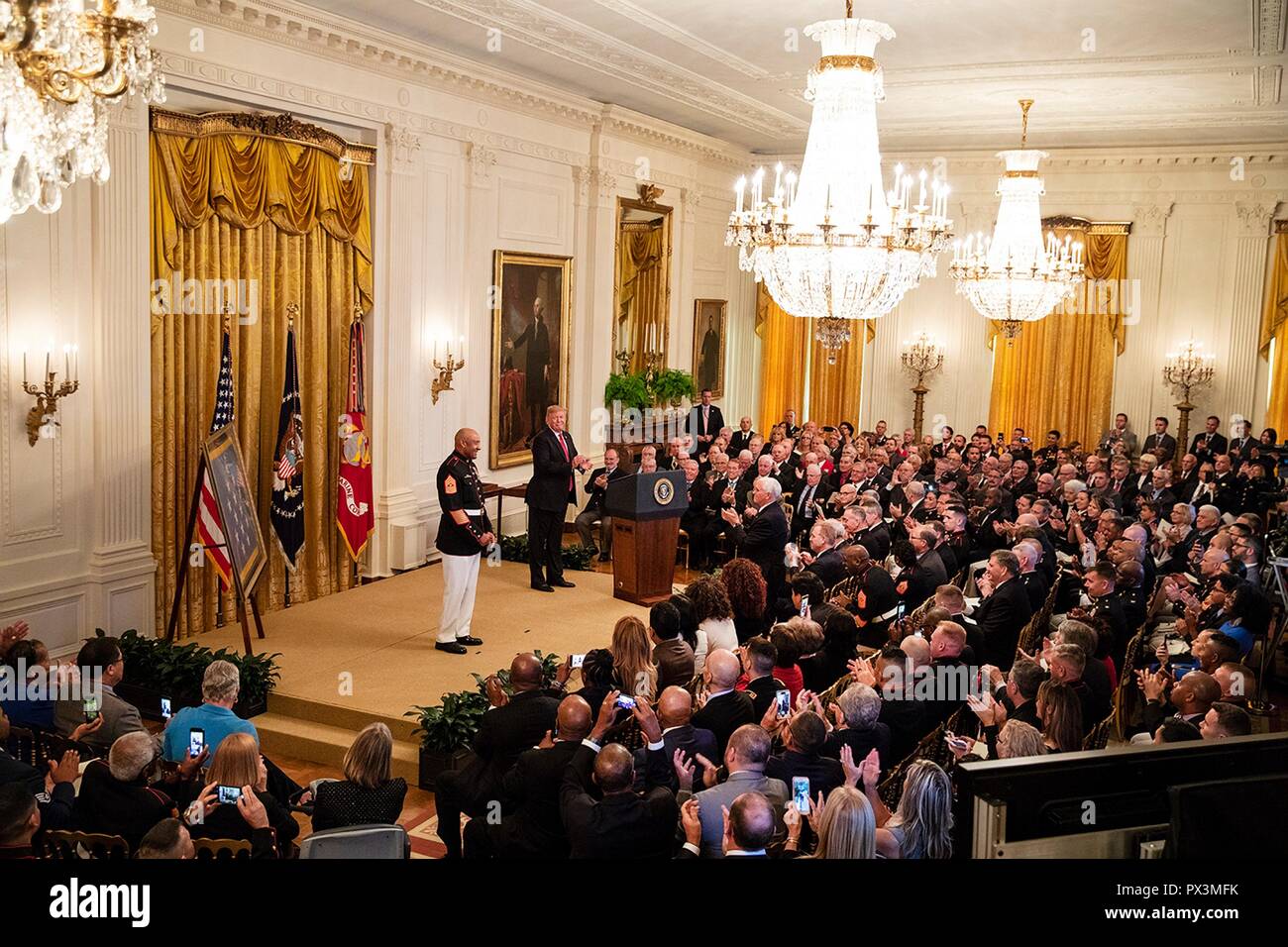 U.S President Donald Trump presents the Medal of Honor to retired U.S. Marine Sgt. Maj. John Canley during a ceremony in the East Room of the White House October 17, 2018 in Washington, DC. Canley received the nations highest honor for actions during the Battle of Hue in the Vietnam War. Stock Photo