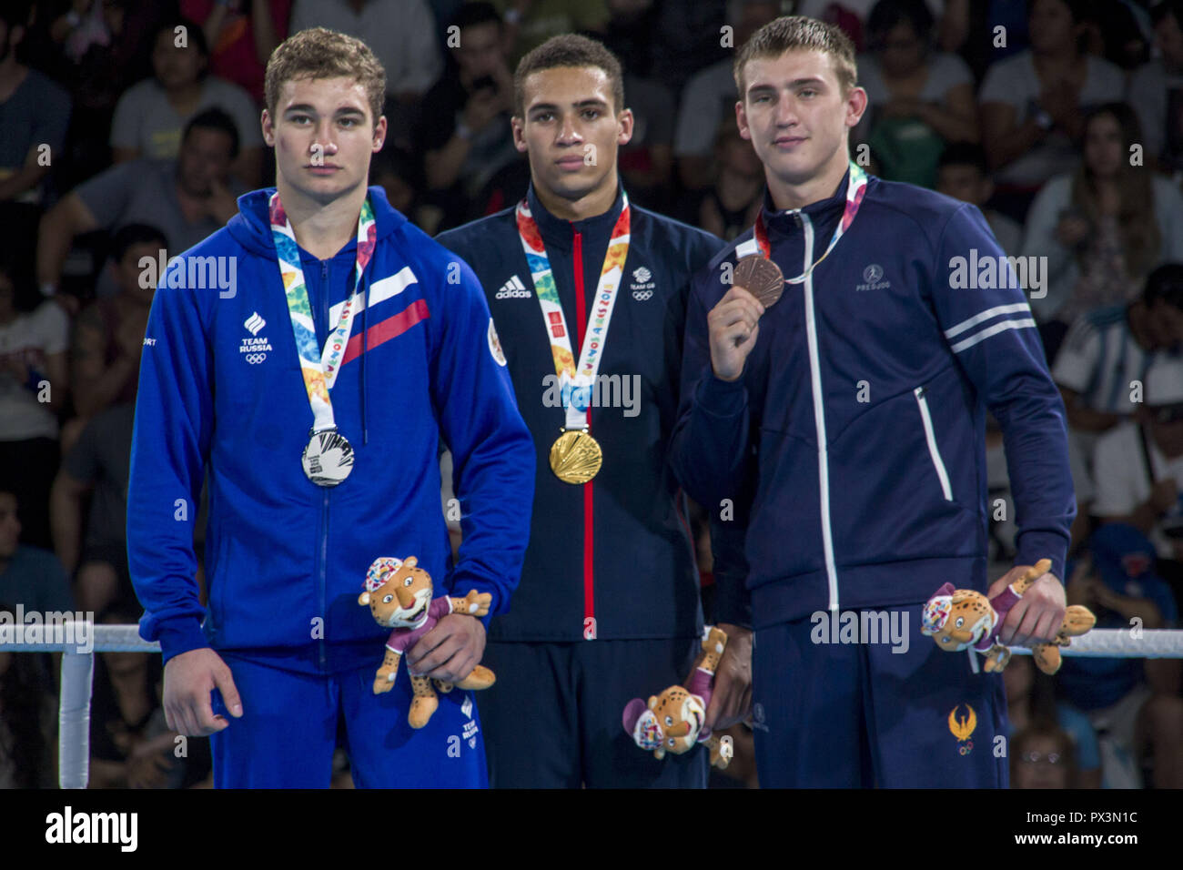 Buenos Aires, Buenos Aires, Argentina. 18th Oct, 2018. Prize of the semi-heavy weight of masculine boxing in the Olympic Games of the Youth, Buenos Aires 2018. The British boxer Itauma Karol was the winner of the gold medal, while the silver medal was won by the boxer Kolesnikov Ruslan of Russia and the Bronze medal Merjanov Timur of Uzbekistan. Credit: Roberto Almeida Aveledo/ZUMA Wire/Alamy Live News Stock Photo