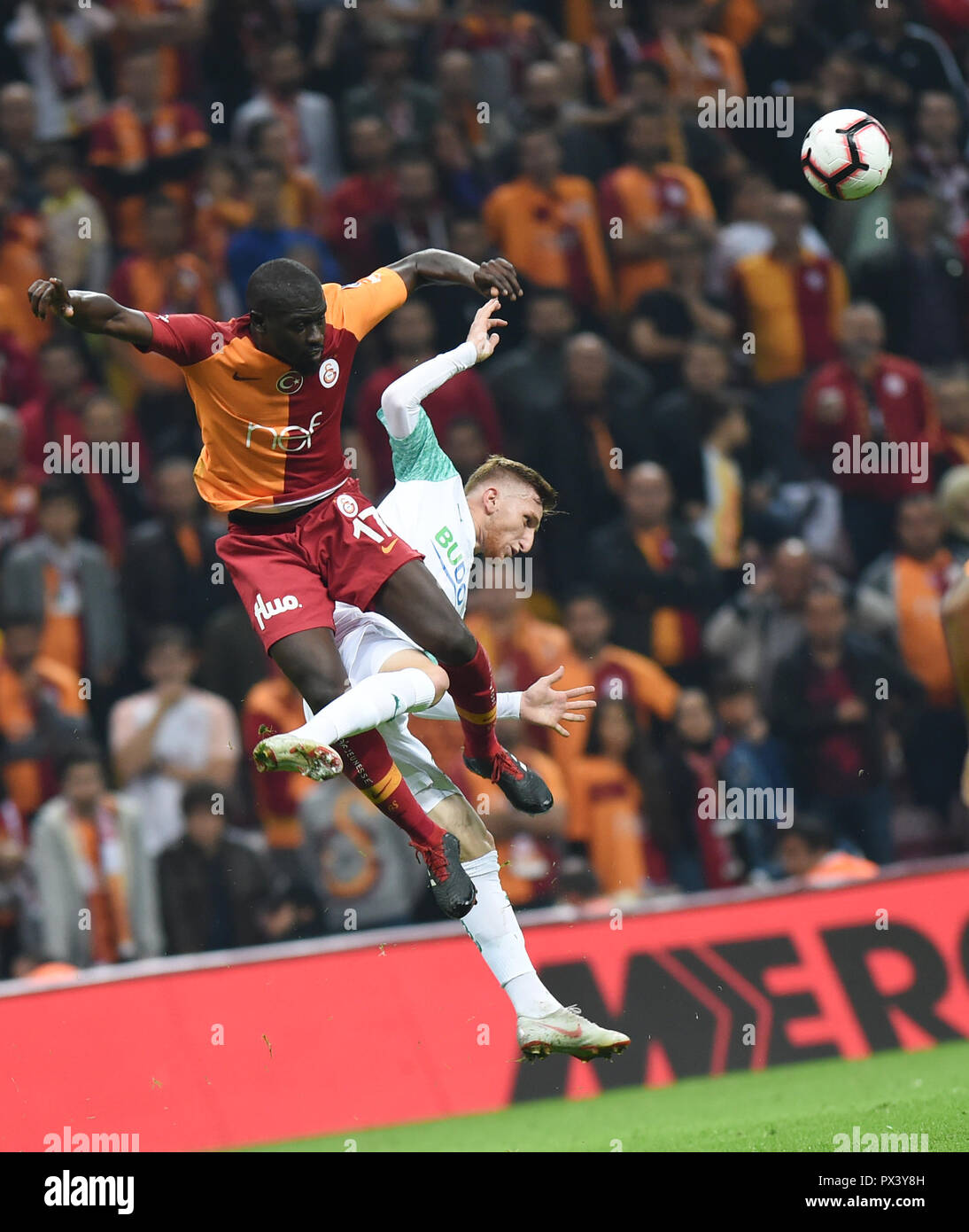Istanbul, Turkey. 19th Oct, 2018. Papa Ndiaye (L) of Galatasaray vies with Burak Kapacak of Bursaspor during a Turkish Super League match in Istanbul, Turkey, Oct. 19, 2018. The match ended with a draw of 1-1. Credit: He Canling/Xinhua/Alamy Live News Stock Photo