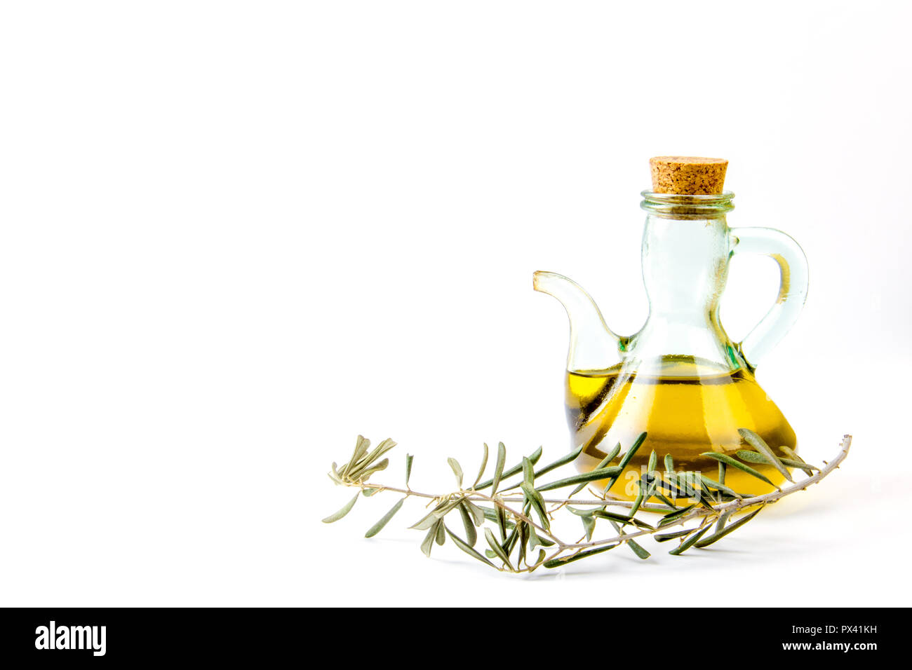 Olive oil glass bottle with an olive tree branch isolated on white background Stock Photo