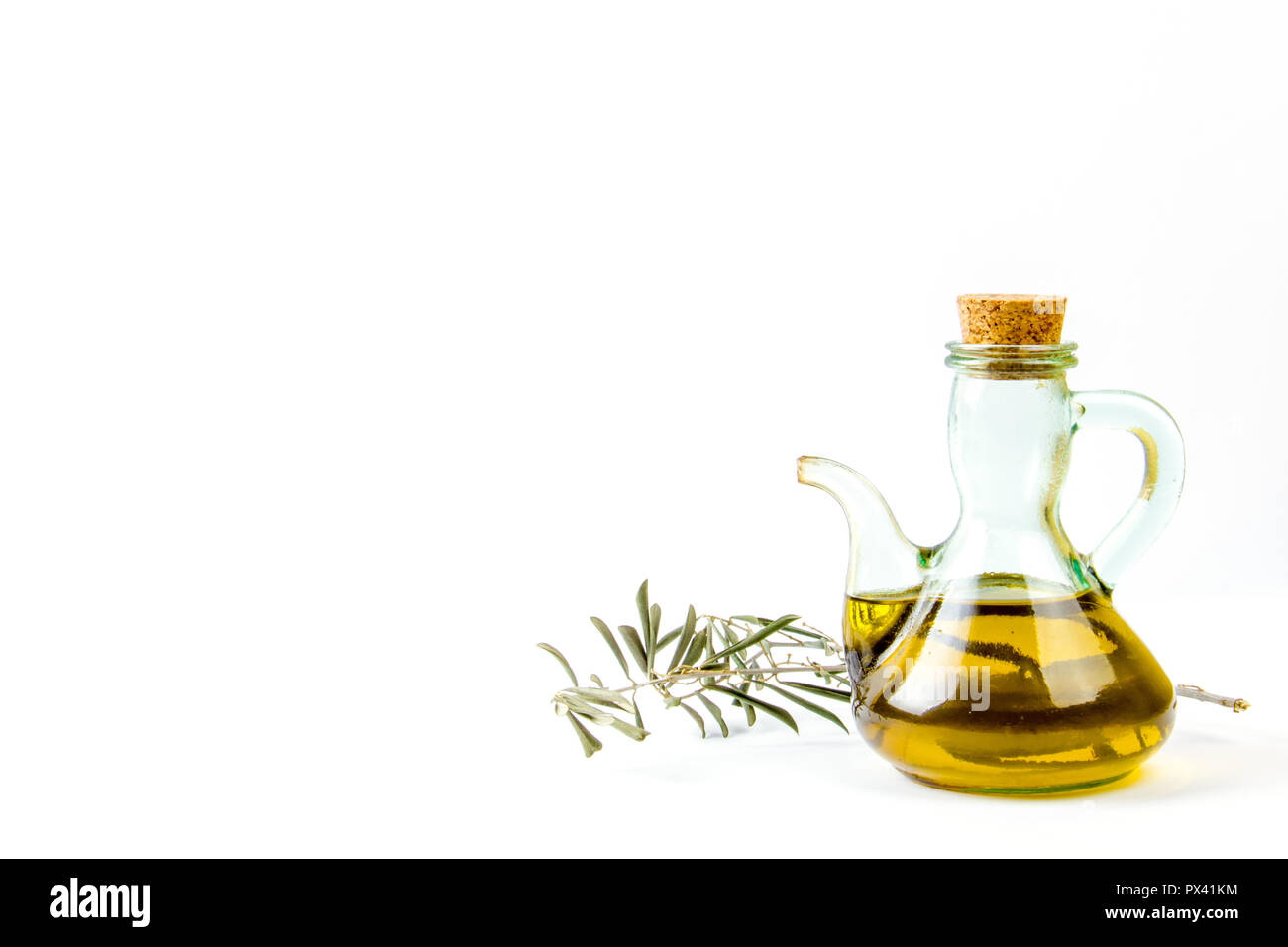 Olive oil glass bottle with an olive tree branch isolated on white background Stock Photo