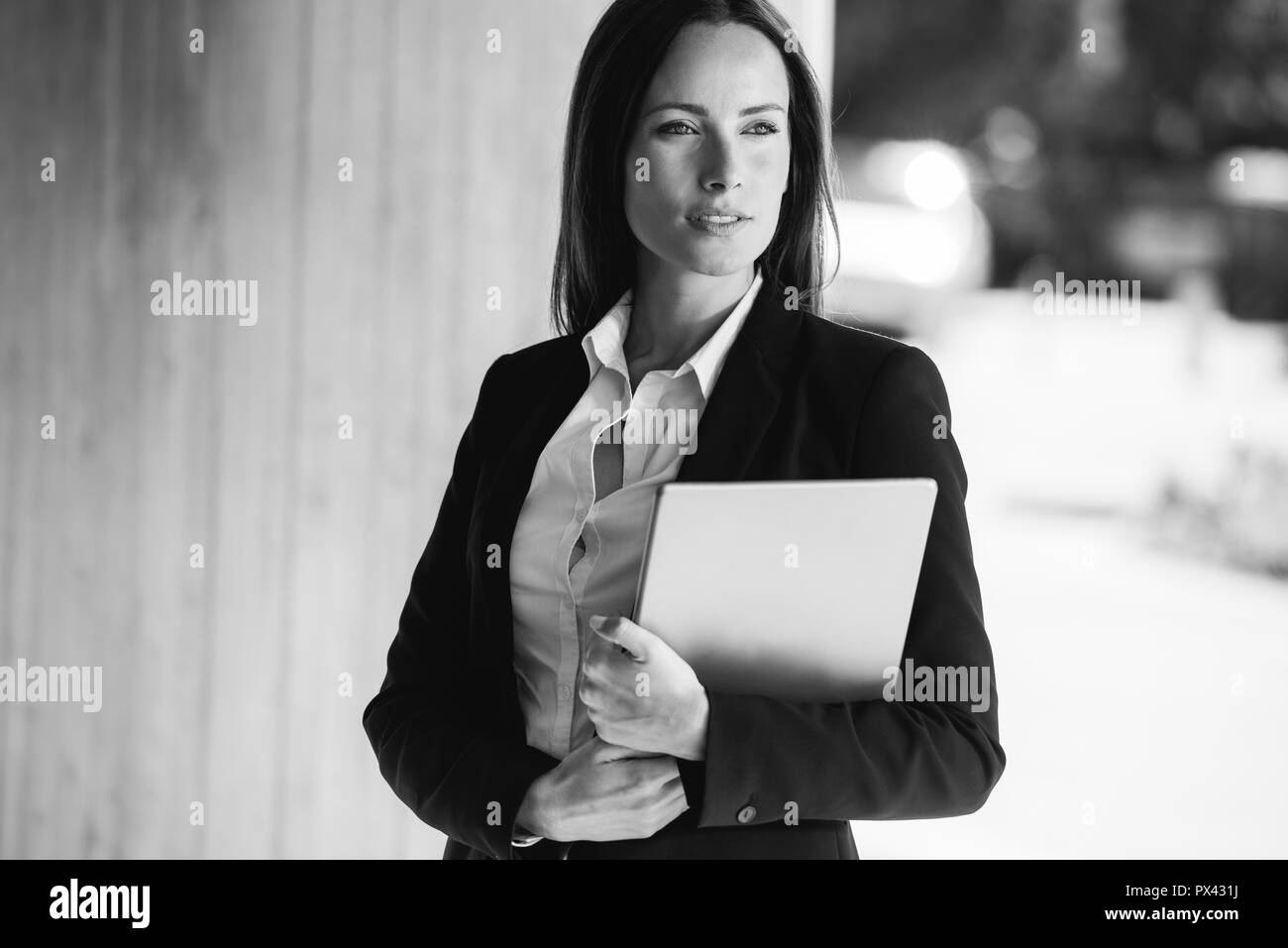 Business woman with crossed arms smiling. With copy space. Stock Photo