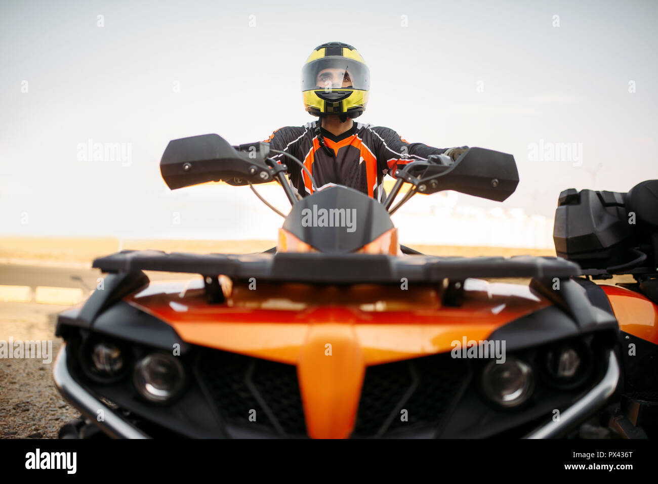 Man on quad with helmet hires stock photography and images Alamy