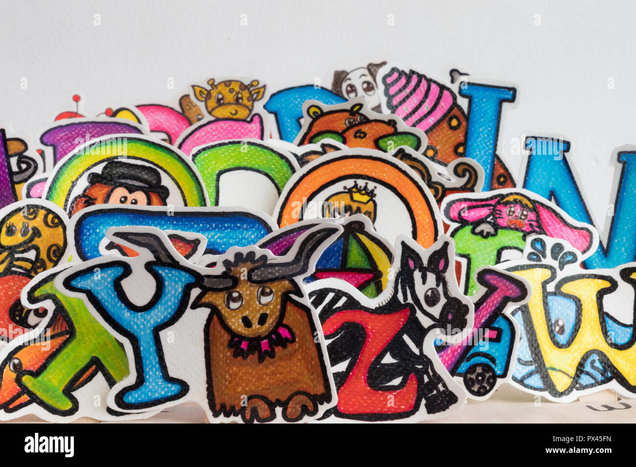 colorful letters with cartoons Stock Photo - Alamy