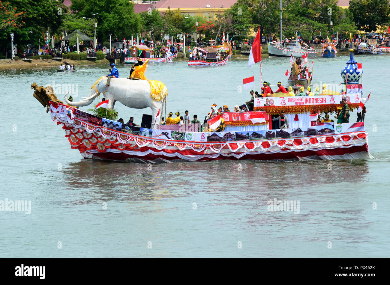 ornamental boat parade during the Aceh kebuyaan week which featured traditional Acehnese boat decorations decorated in various colors and typical deco Stock Photo