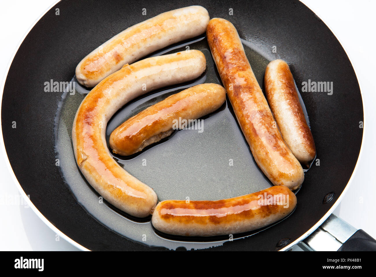 pork sausages fried in oil Stock Photo Alamy