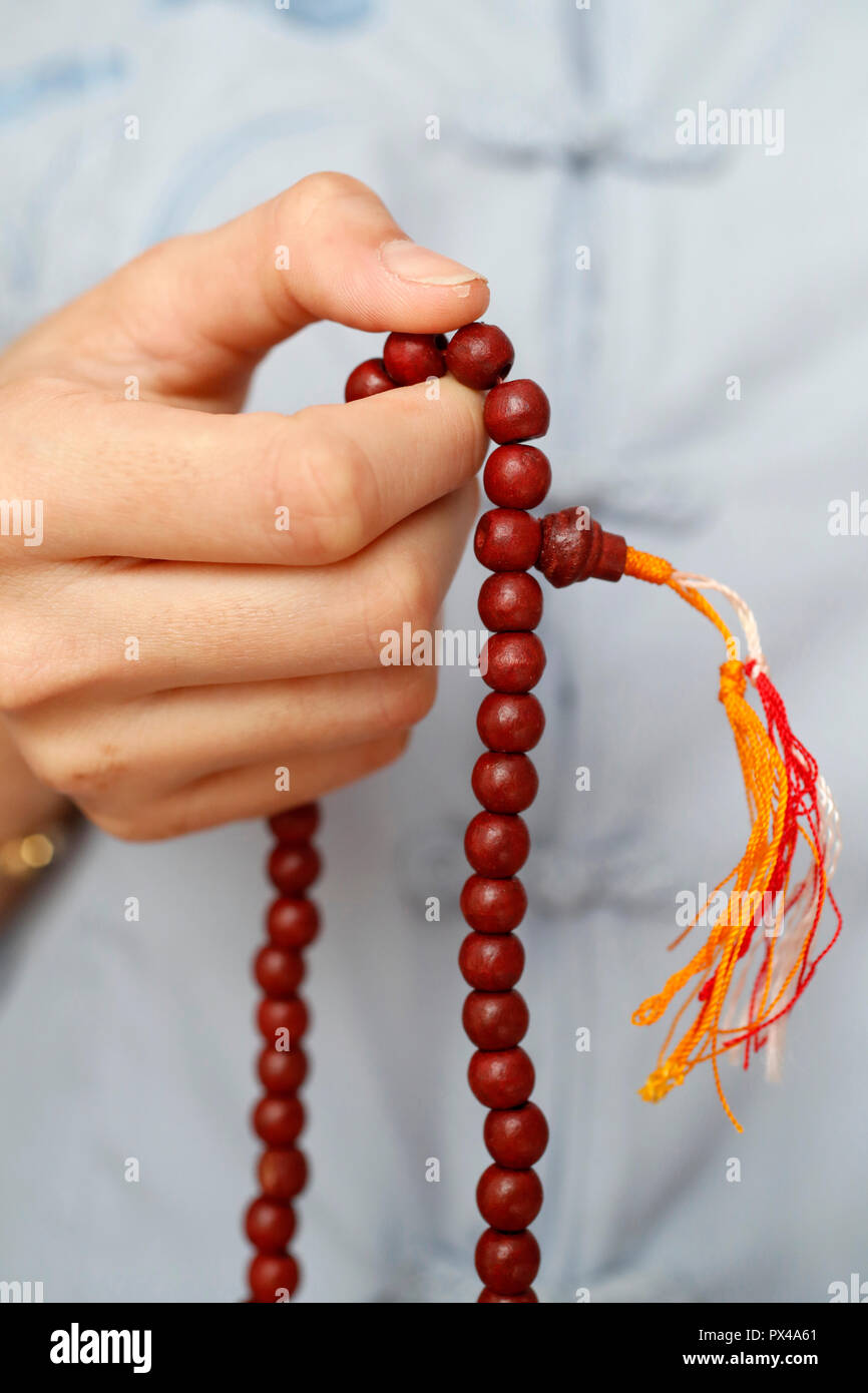 A woman praying Mala beads, the Buddhist prayer beads. Close-up. Ho Chi  Minh City. Vietnam Stock Photo - Alamy