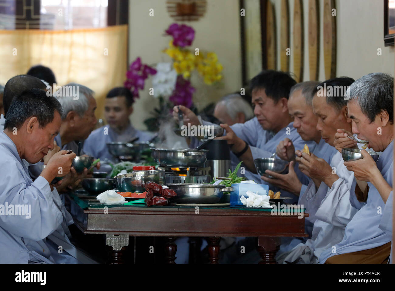 Truc Lam buddhist temple.  Worshippers having vegan meal.  Dalat. Vietnam. Stock Photo