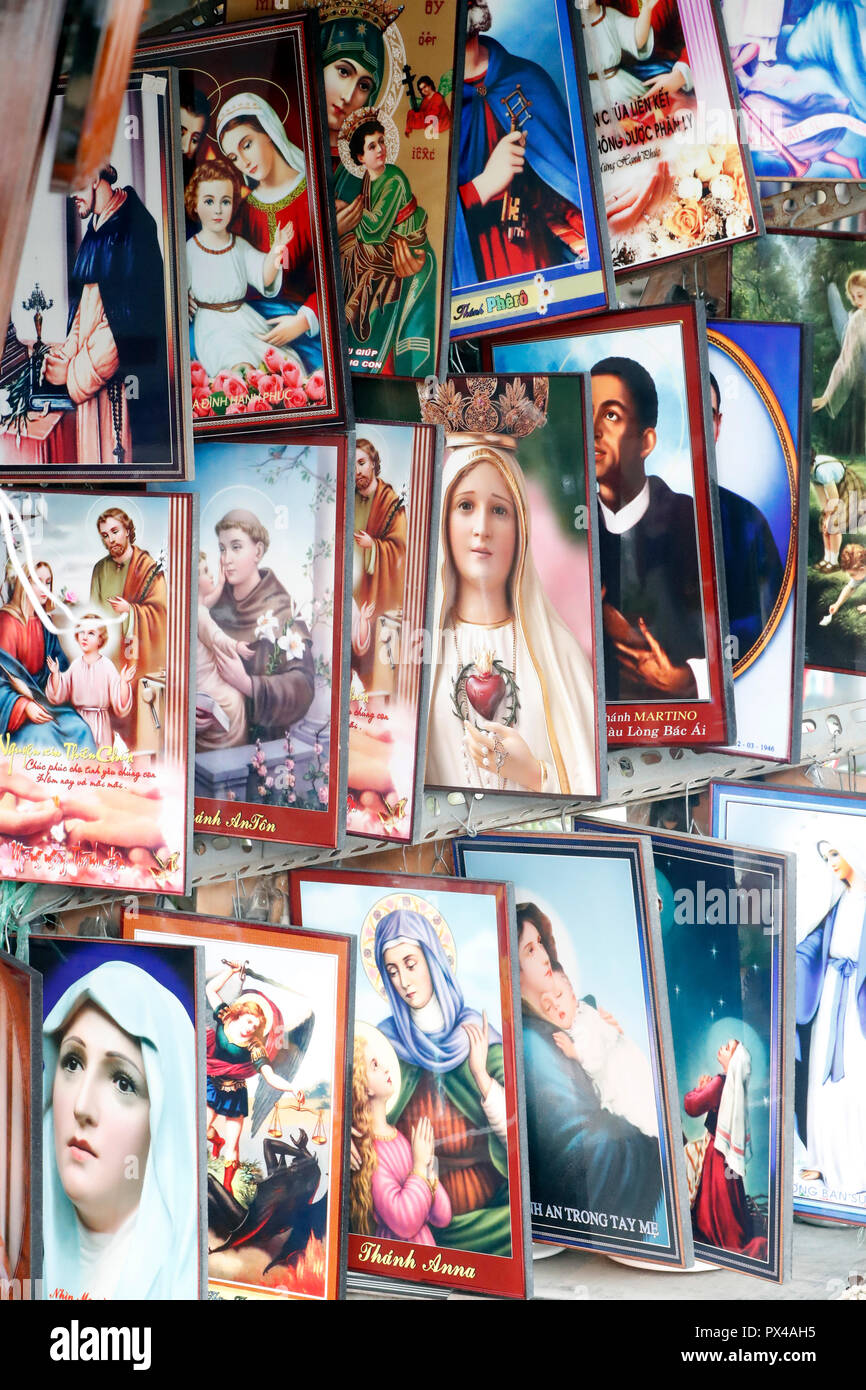 Shop selling religious christian items. Jesus and Virgin Mary images.  Ho Chi Minh City. Vietnam. Stock Photo