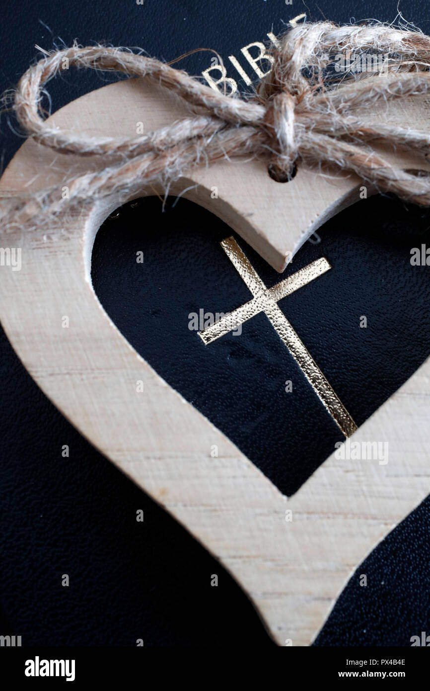 A wooden heart and  the Holy Bible. Stock Photo