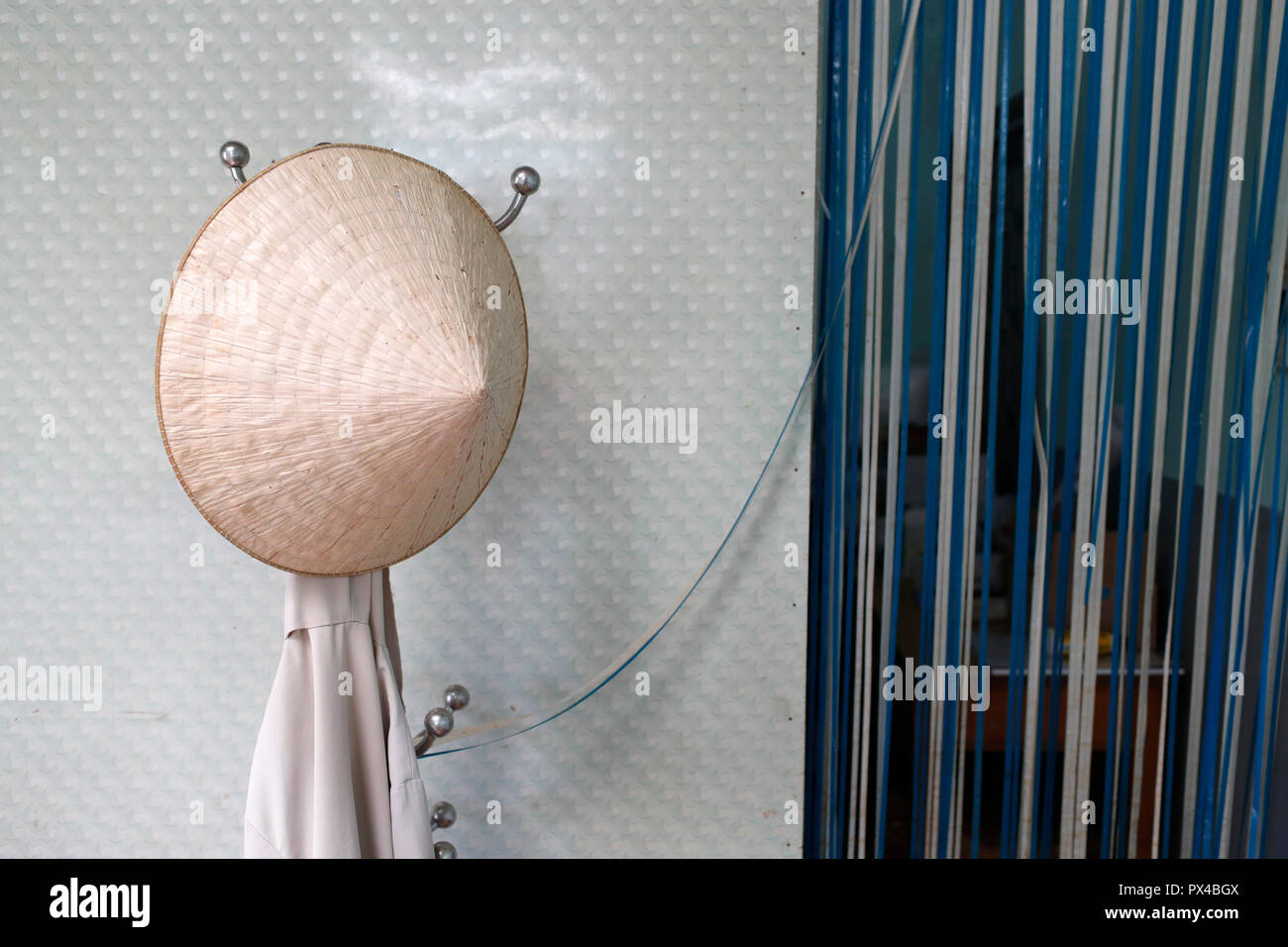 Free health clinic run by the Franciscan Missionaries of Mary. Vietnamese hat and curtain.  Dalat. Vietnam. Stock Photo