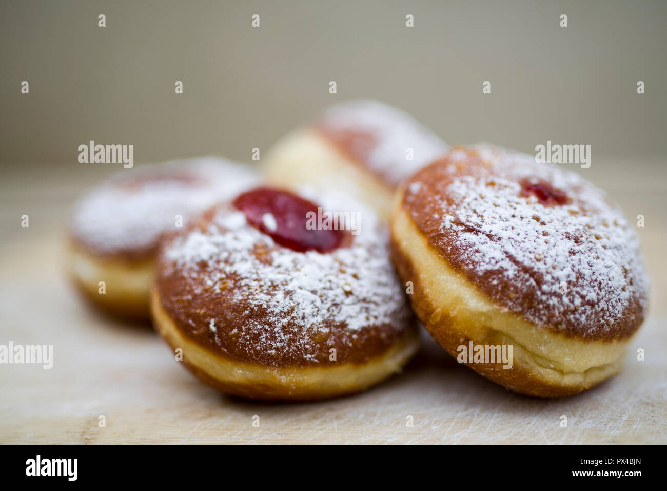 Traditional food for hanukkah is jelly doughnuts with sugar powder. Stock Photo