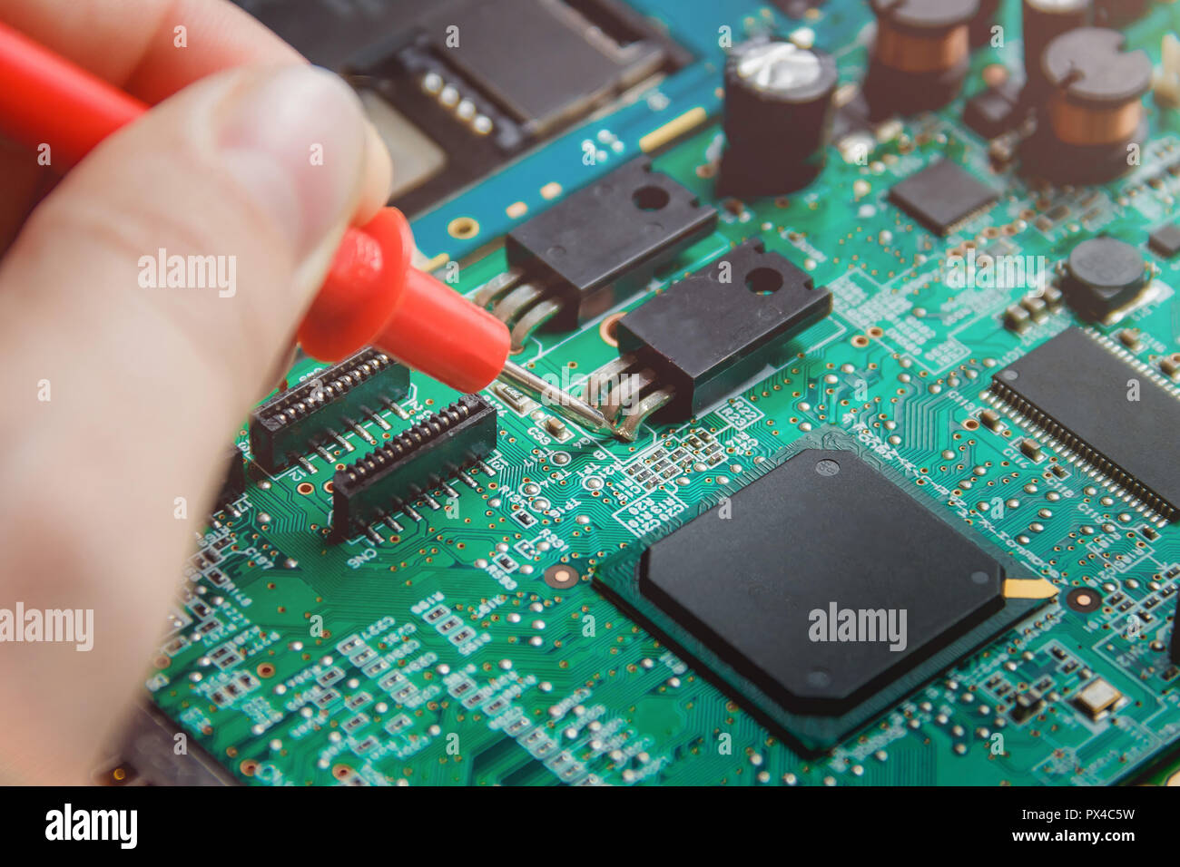 Printed Circuit Board with many electrical components. Stock Photo
