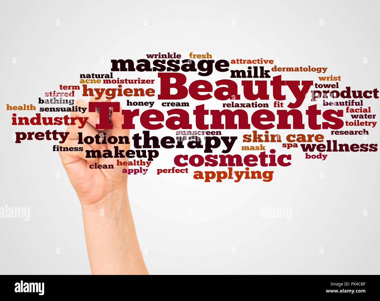 Beauty Treatments word cloud and hand with marker concept on white background. Stock Photo