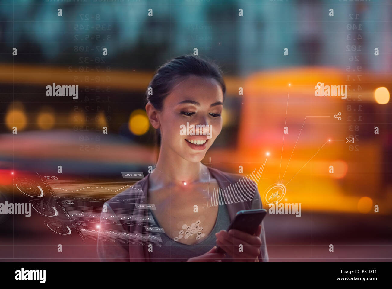 Staying up to date with technology in a fast moving world, concept. A young asian woman is using innovative smart future technology to view city data Stock Photo
