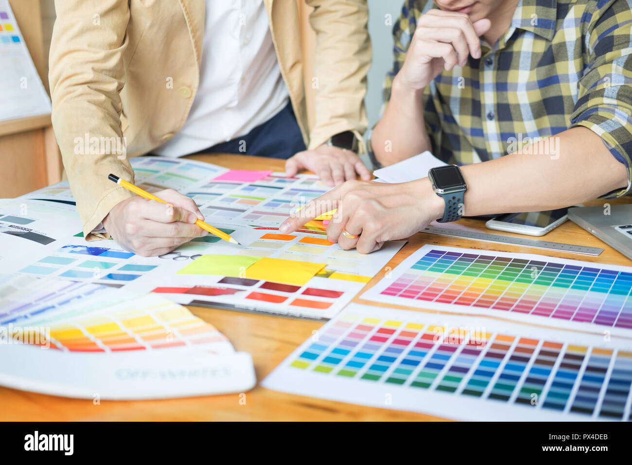 Creative Graphic designer at work. Color swatch samples pantone palette