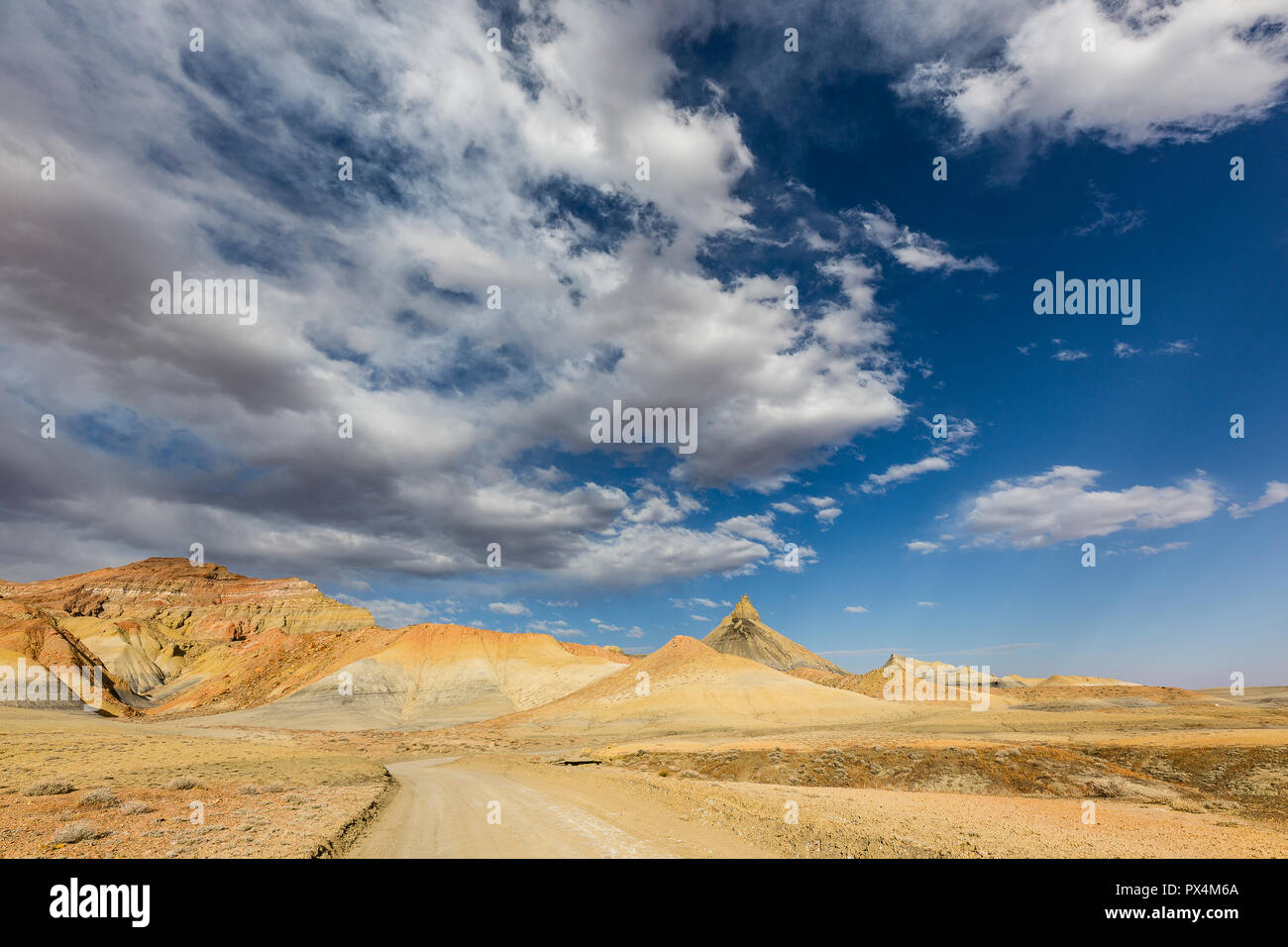 Alstrom Point, AZ, USA. Dirt road towards Alstrom Point under blue skies and scattered clouds. Stock Photo