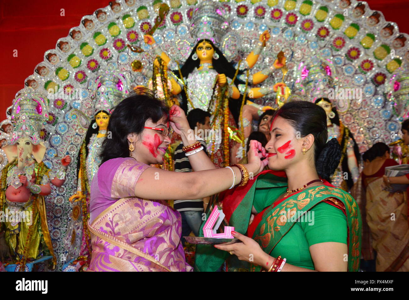 Durga Puja / Navratri in kolkata, India ends with the celebration of 'Sindoor Khela'. ('vermillion game'). Hindu women specially bengali women smear e Stock Photo