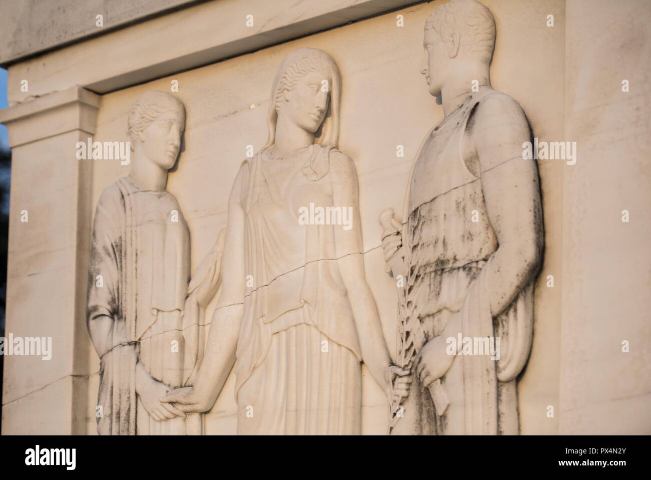 Color photograph of the East facing panel of the Tomb of the Unknown Soldier, shot from a low angle, showing a bas-relief sculpture depicting the Classical allegorical figures Peace, Victory, and Valor, located at Arlington National Cemetery, in Arlington, Virginia, USA, image courtesy Elizabeth Fraser and the Arlington National Cemetery, August 7, 2018. () Stock Photo