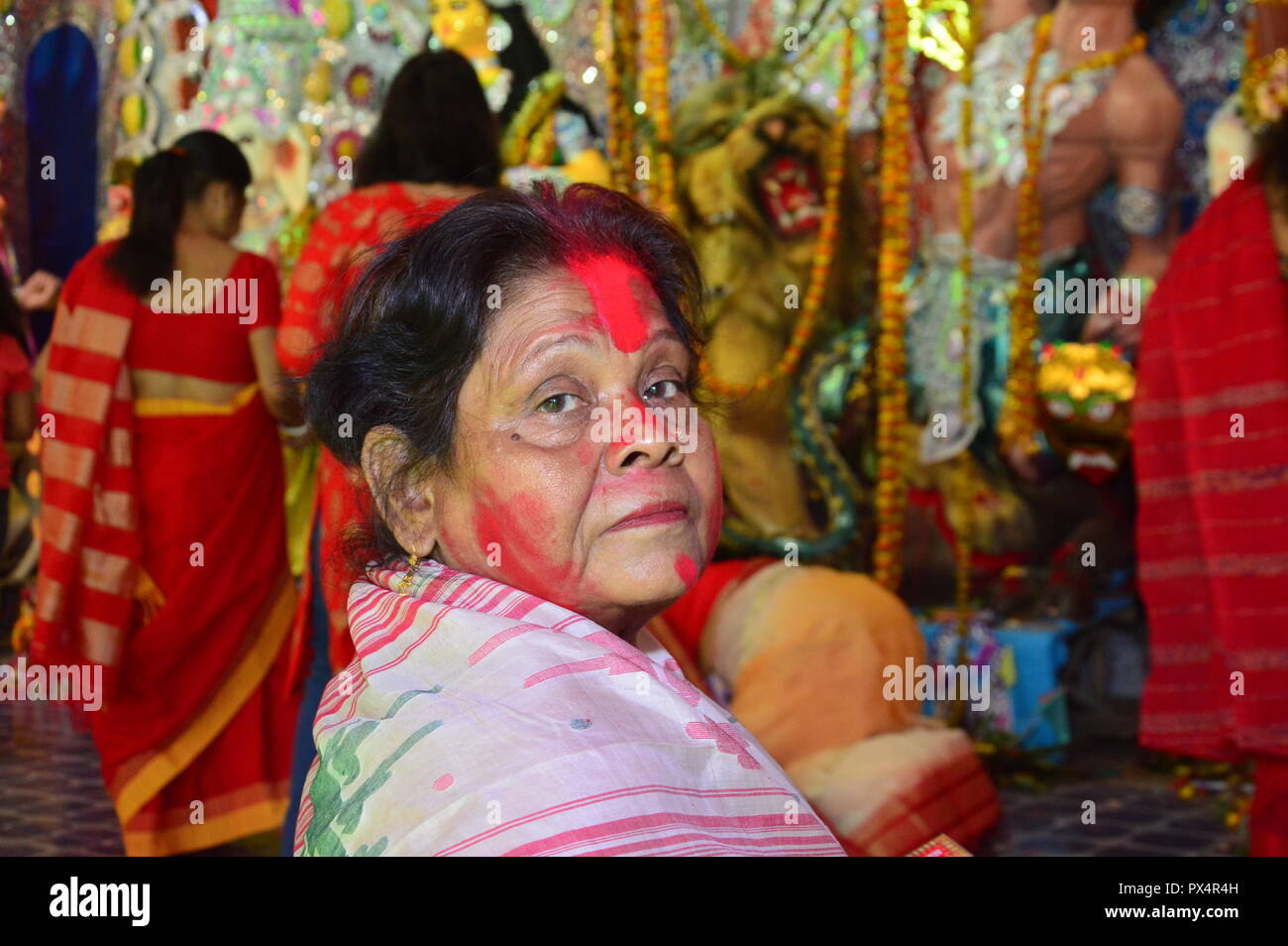 Durga Puja / Navratri in kolkata, India ends with the celebration of 'Sindoor Khela'. ('vermillion game'). Hindu women specially bengali women smear e Stock Photo