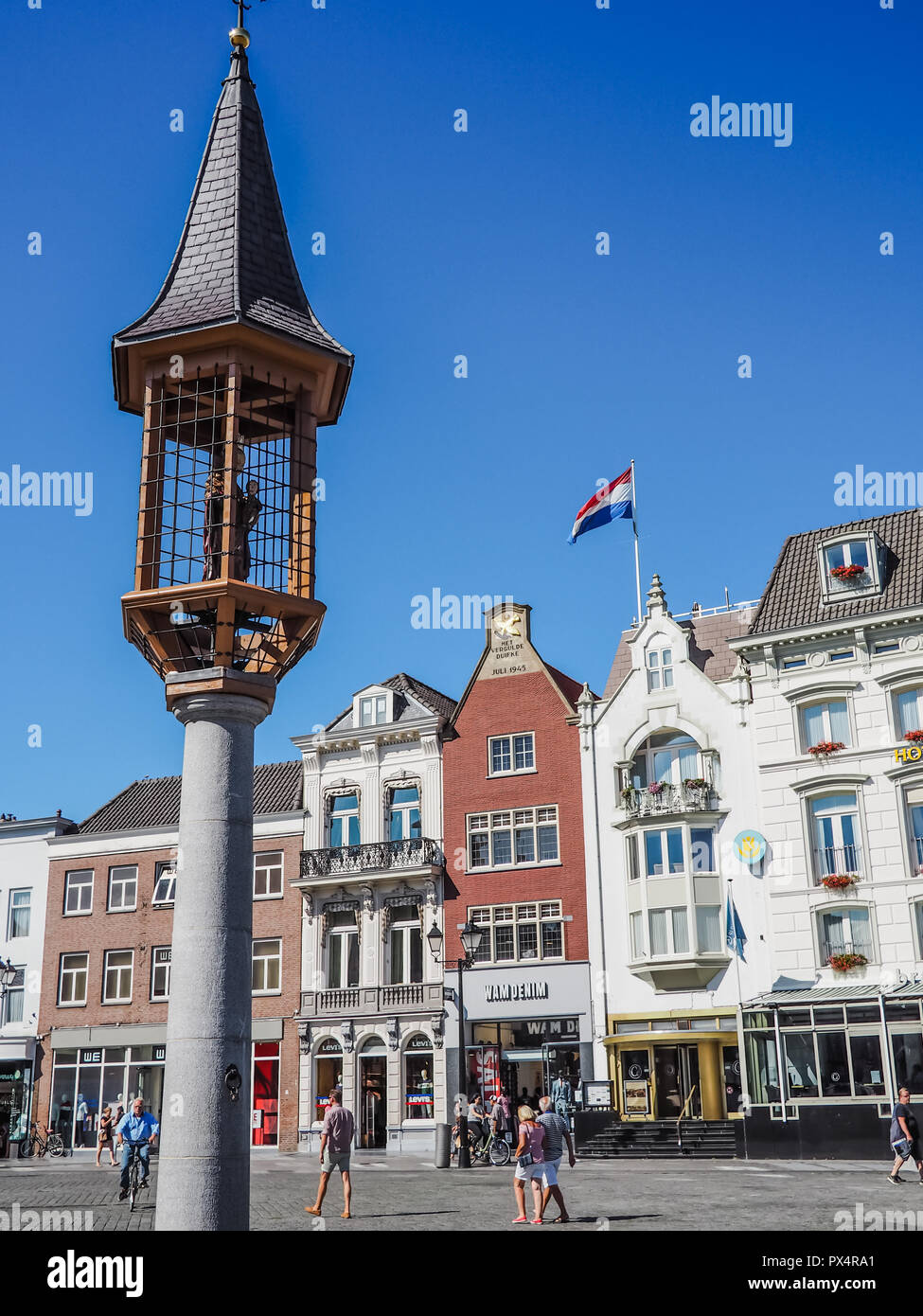 's-Hertogenbosch, Netherlands - August 2018: Small tower with statue of Saint Mary holding Jesus on the market square in the city center Stock Photo
