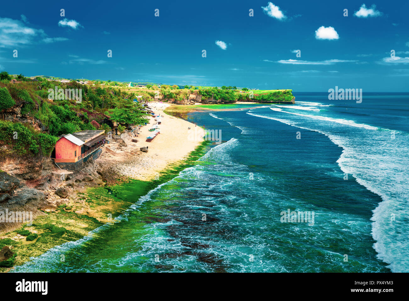 Azure beach with rocky mountains and clear water of Indian ocean at sunny  day / A view of a cliff in Bali Indonesia / Bali, Indonesia Stock Photo -  Alamy