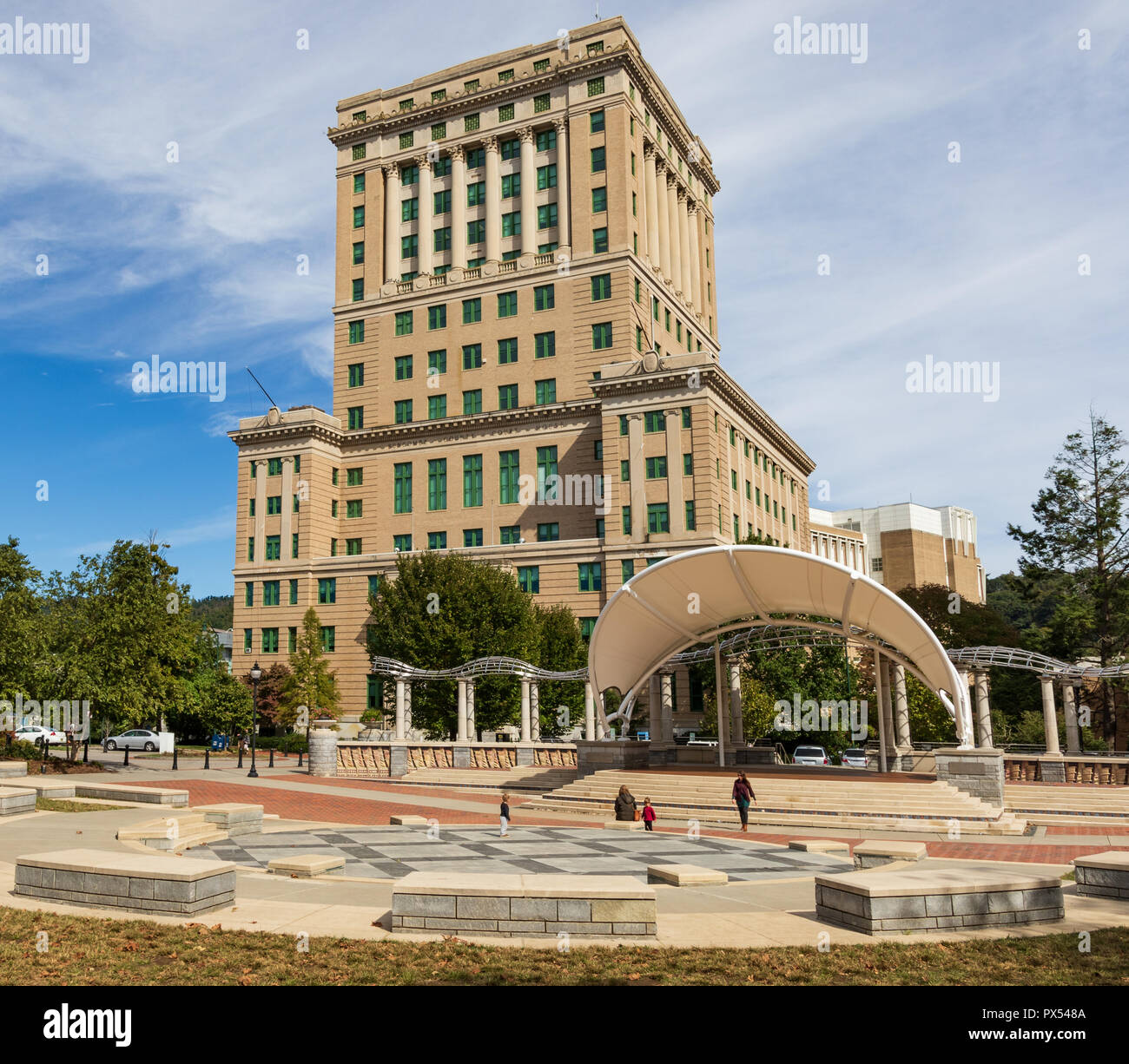 ASHEVILLE, NC, USA-10/17/18: The 17-story Buncombe County Courthouse sets behid an amphiteater in Pack Square. Stock Photo