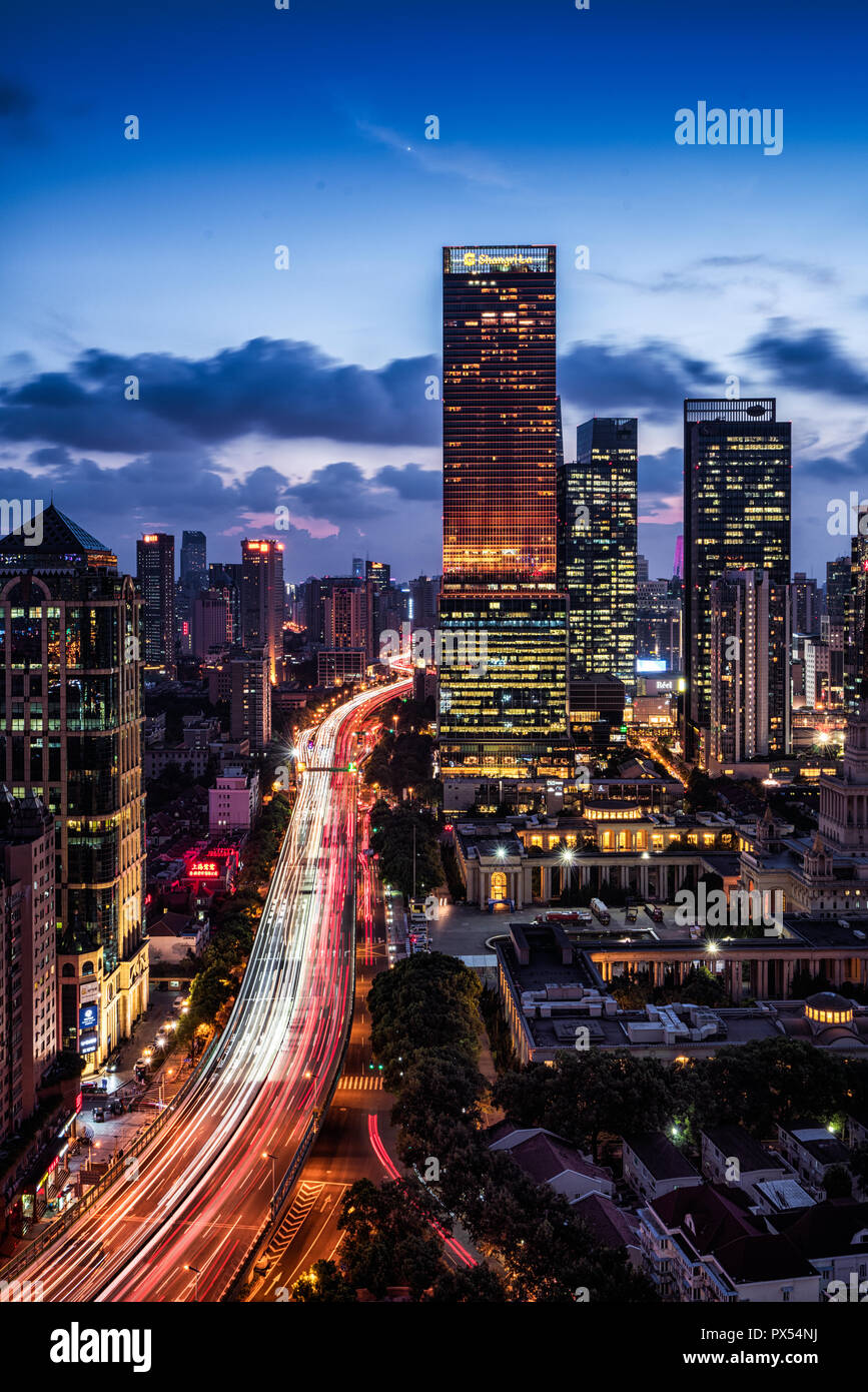 Traffic light trail and the city at the night Stock Photo - Alamy