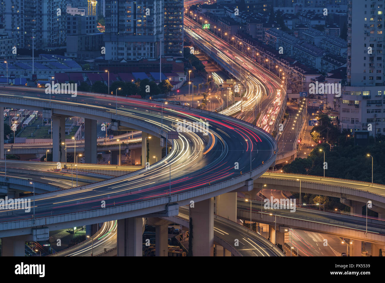 Areial View of the traffic light trail on the freeway and the city ...