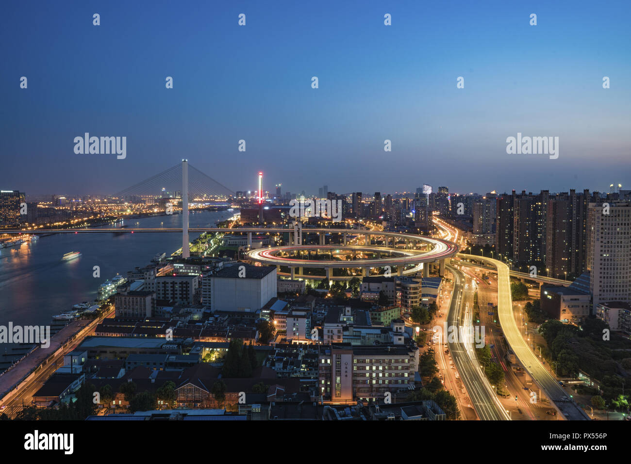 Areial View of the traffic light trail and the city Stock Photo - Alamy