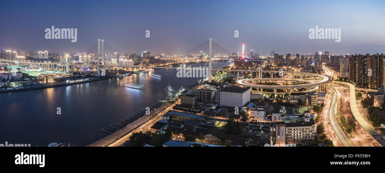 Areial View of the traffic light trail and the city Stock Photo - Alamy