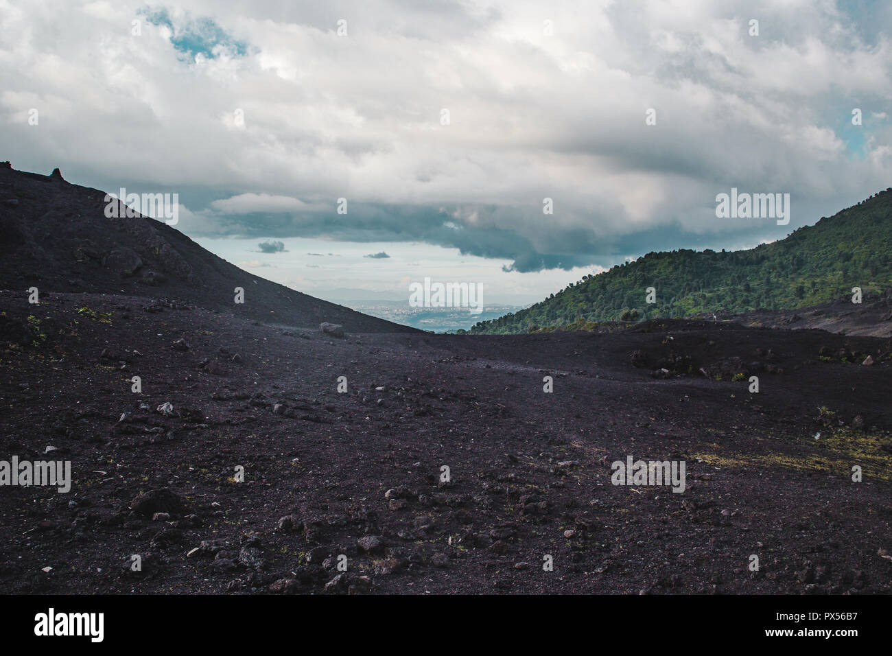 Changing landscapes around the Volcan Pacaya, one of Guatemala's most active volcanoes, from black volcanic rock to lush green forests Stock Photo