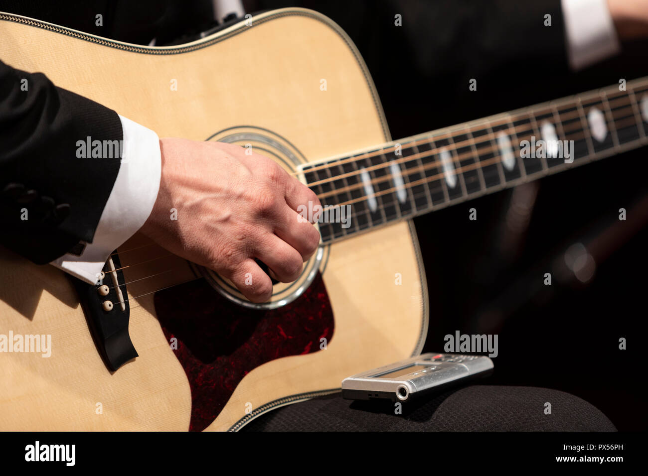 Person playing the guitar hi-res stock photography and images - Alamy
