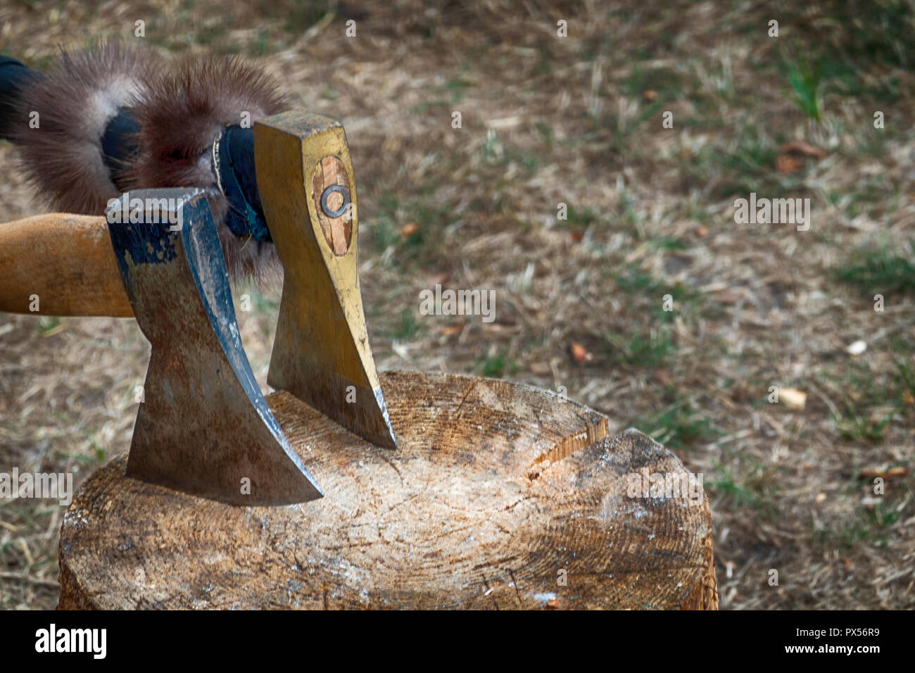 Wooden block for chopping wood with two hand axes Stock Photo Alamy