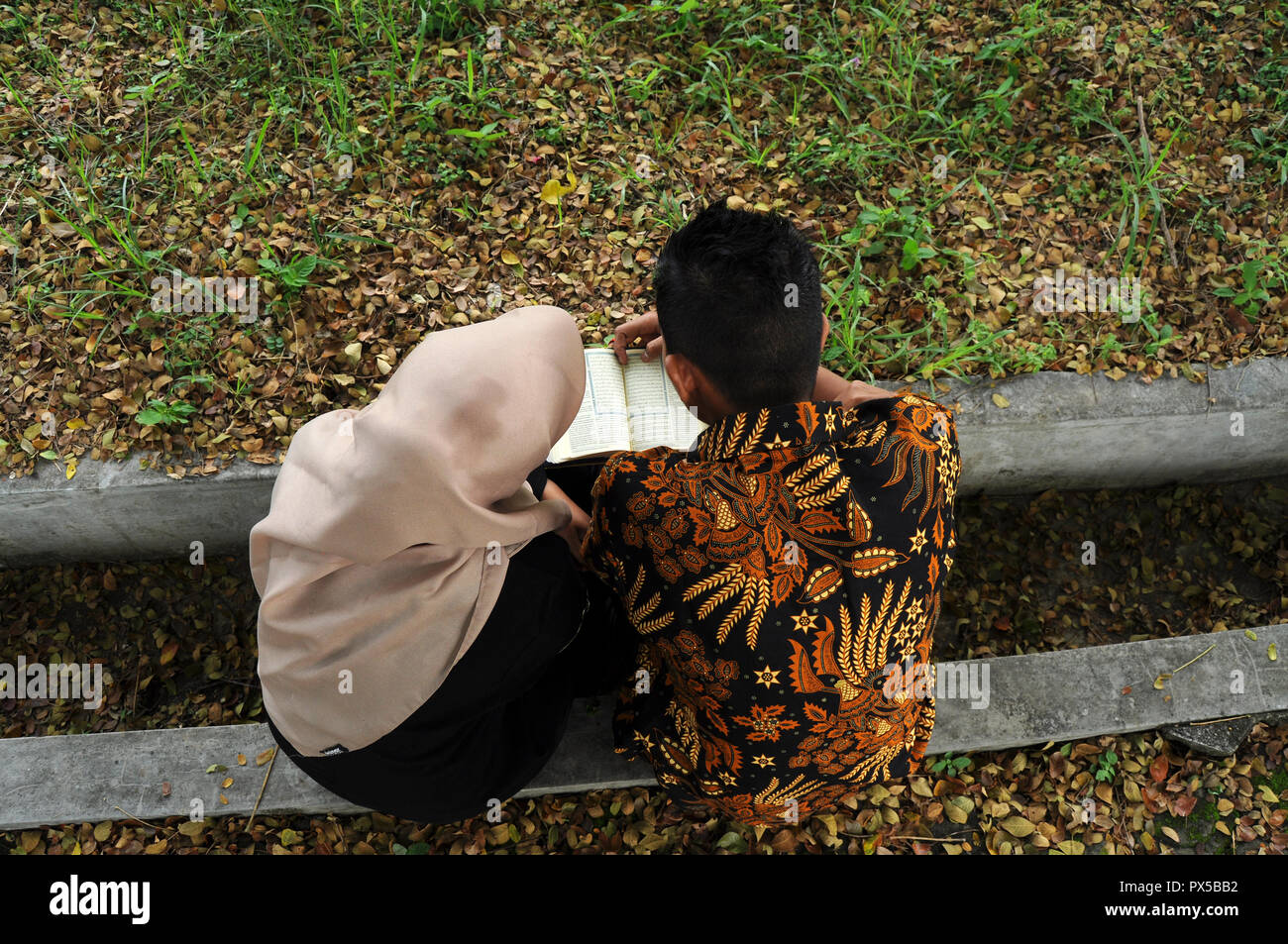 The pilgrimage couple visited the Aceh tsunami mass grave on December 26, 2017 as a day commemorated as the day of the December 26, 2004 tsunami that Stock Photo