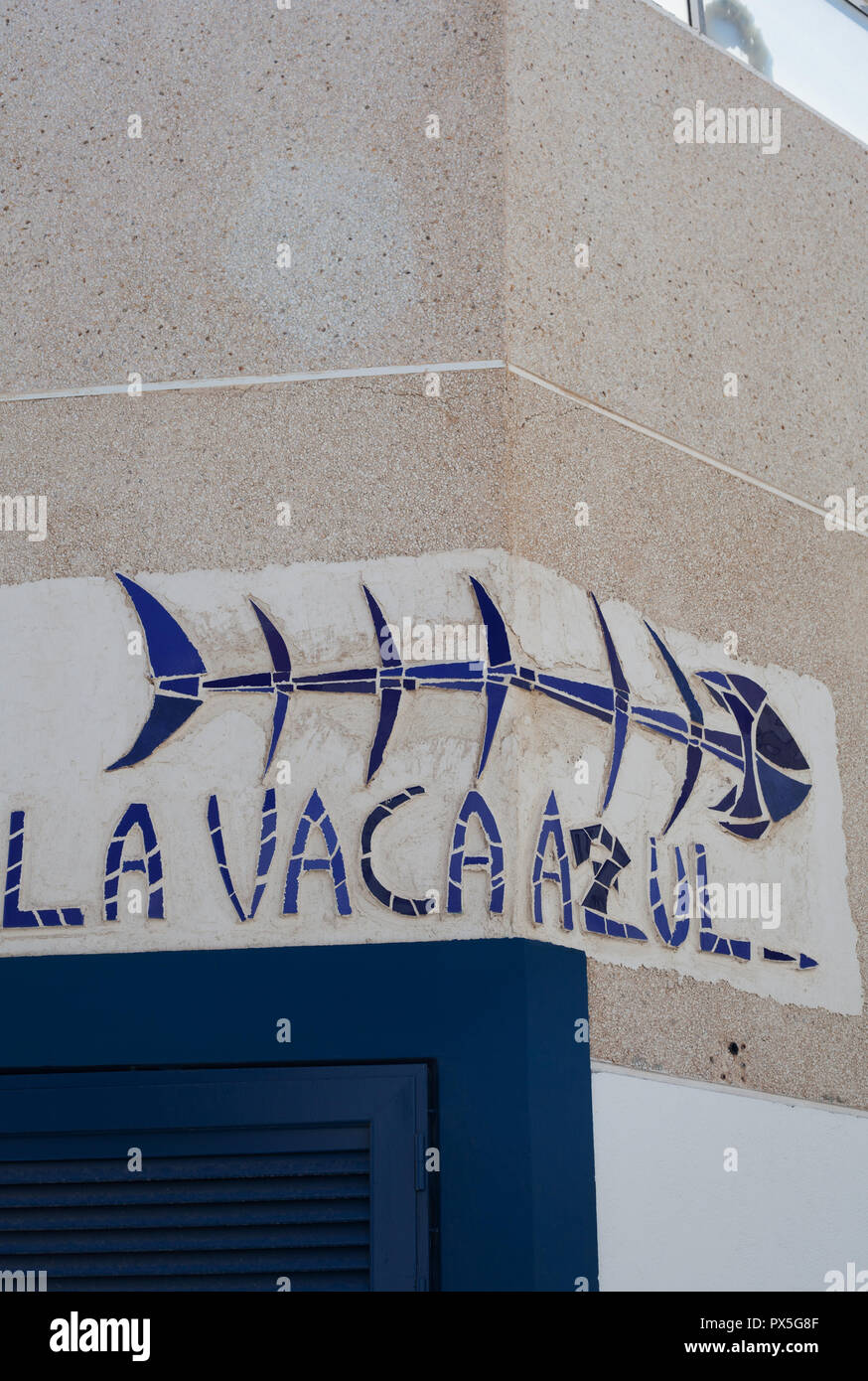 Street sign for La Vaca Azul (the Blue Cow) restaurant in El Cotillo, La Oliva, Fuerteventura, Canary Islands, Spain Stock Photo